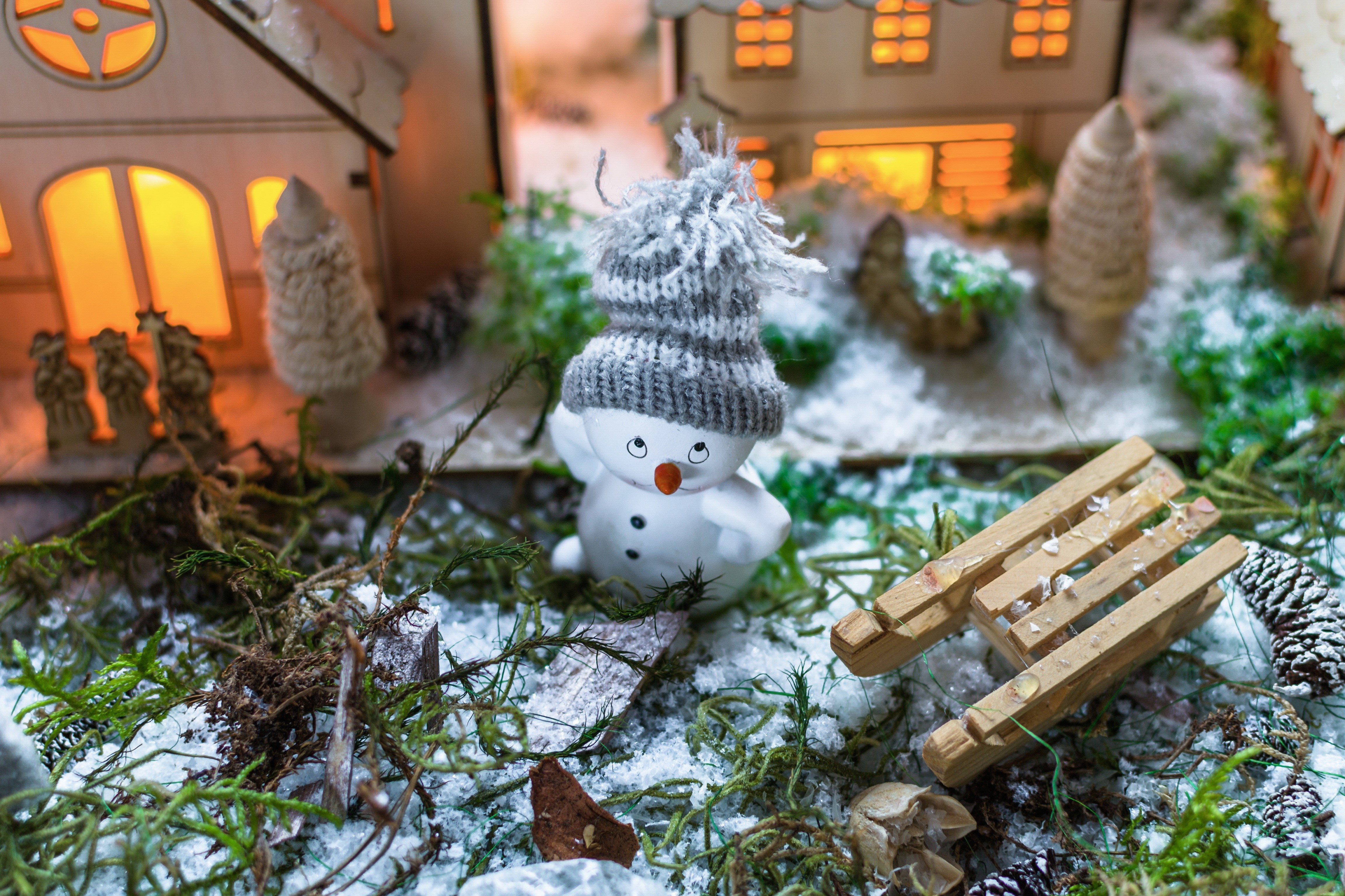 Christmas scene with snowman and sled HD Wallpaper