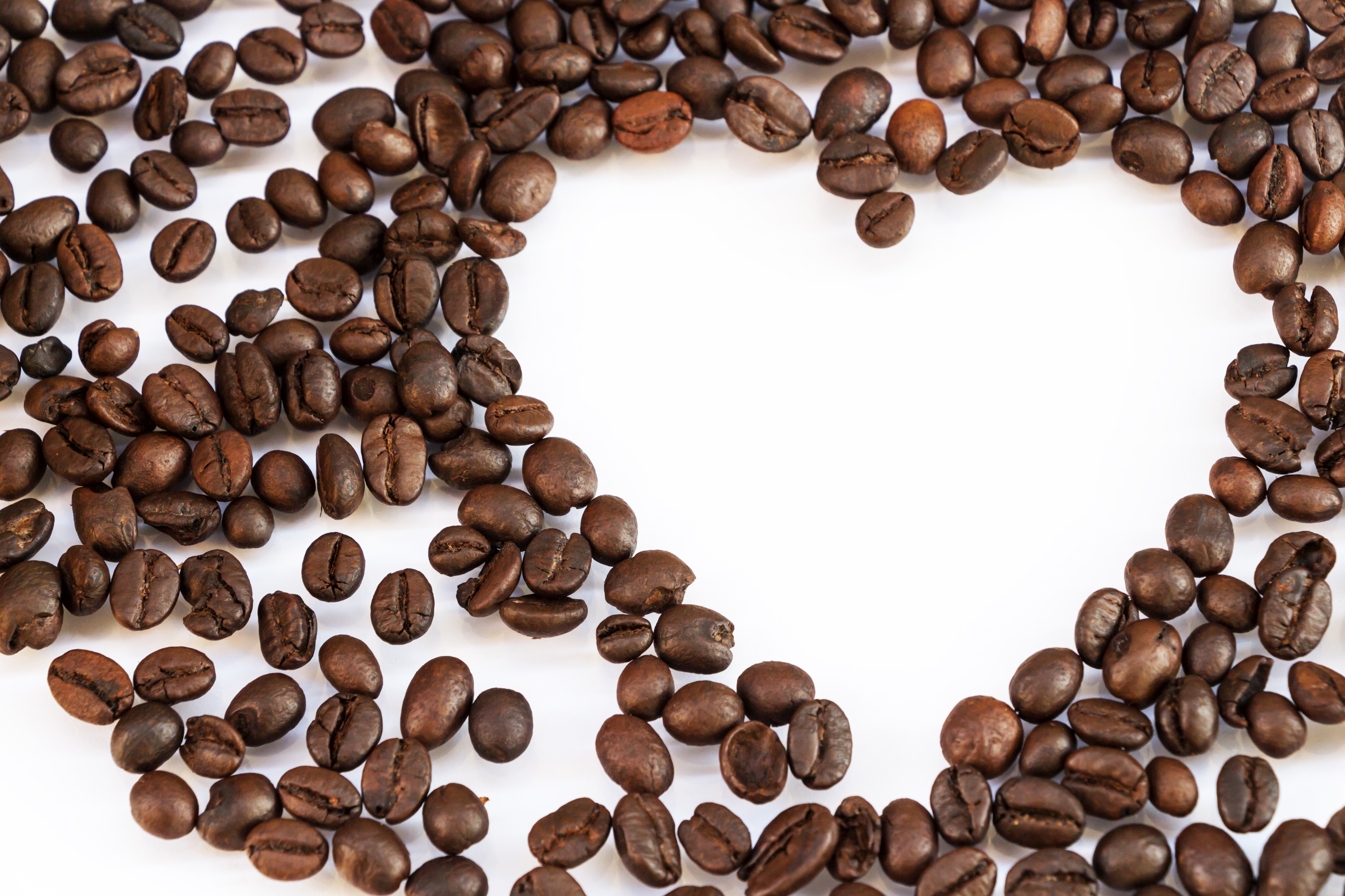 Coffee beans arranged in a heart shape HD Wallpaper