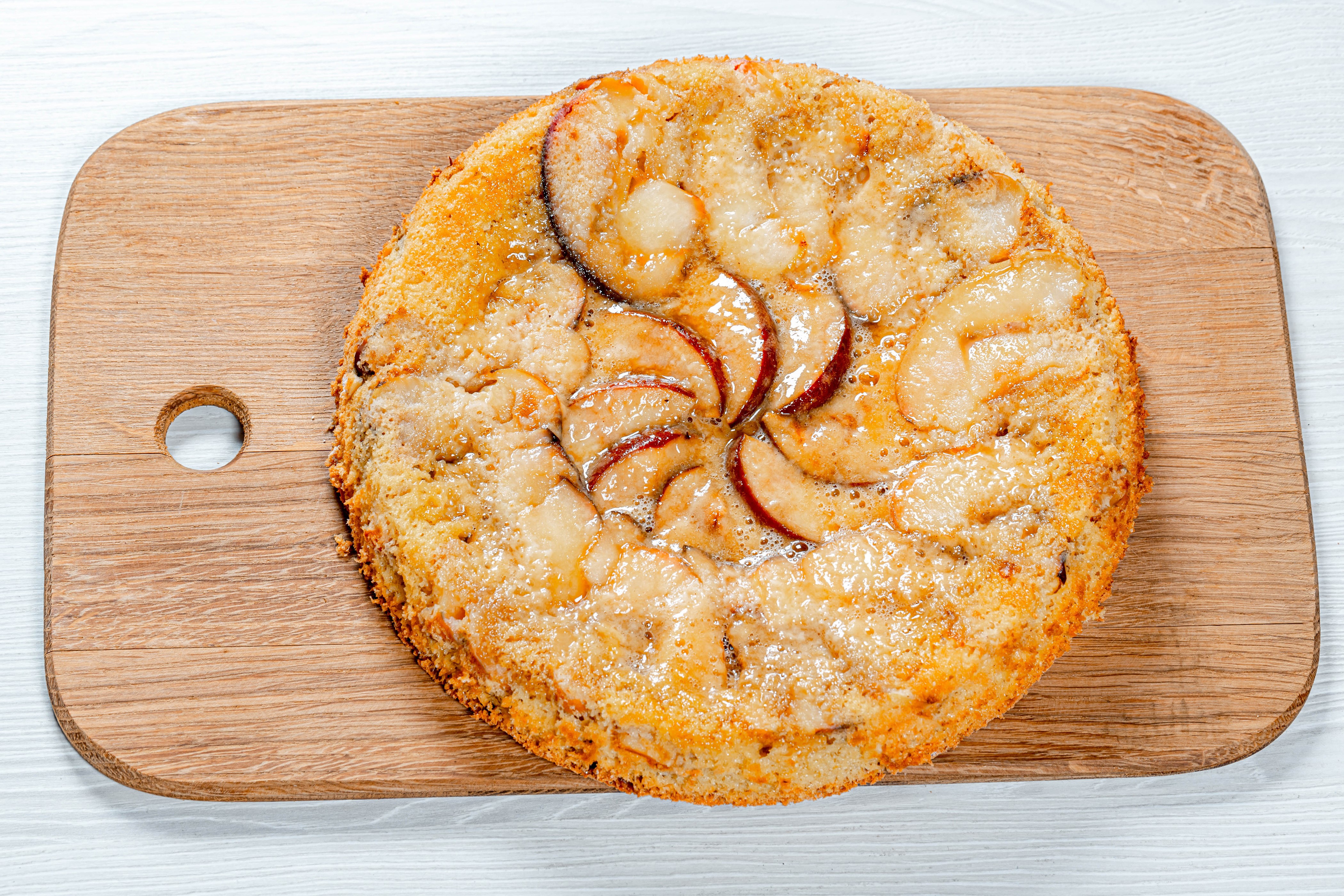 Apple cake on a wooden cutting board HD Wallpaper