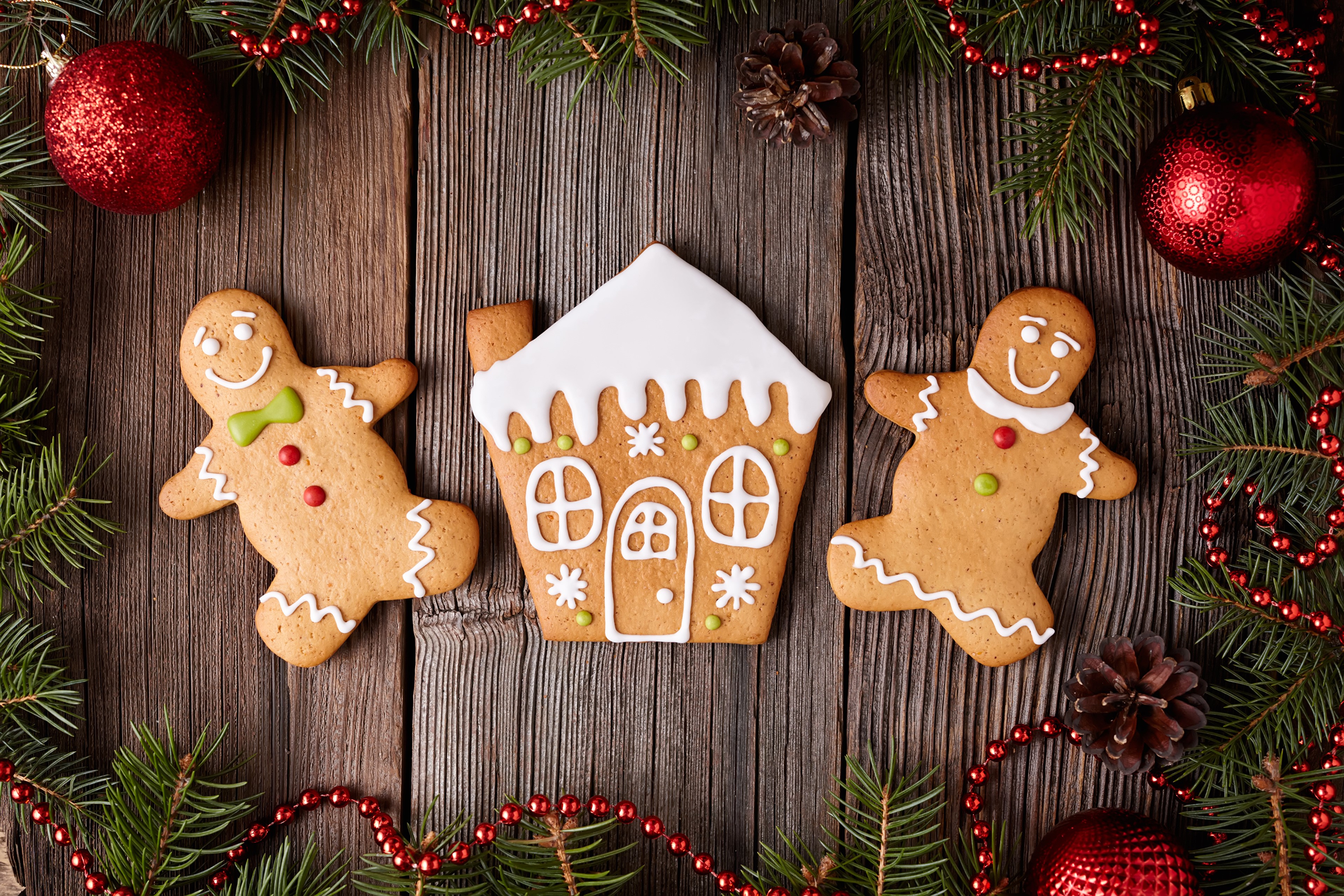 Christmas gingerbread cookies and decorations on wood HD Wallpaper