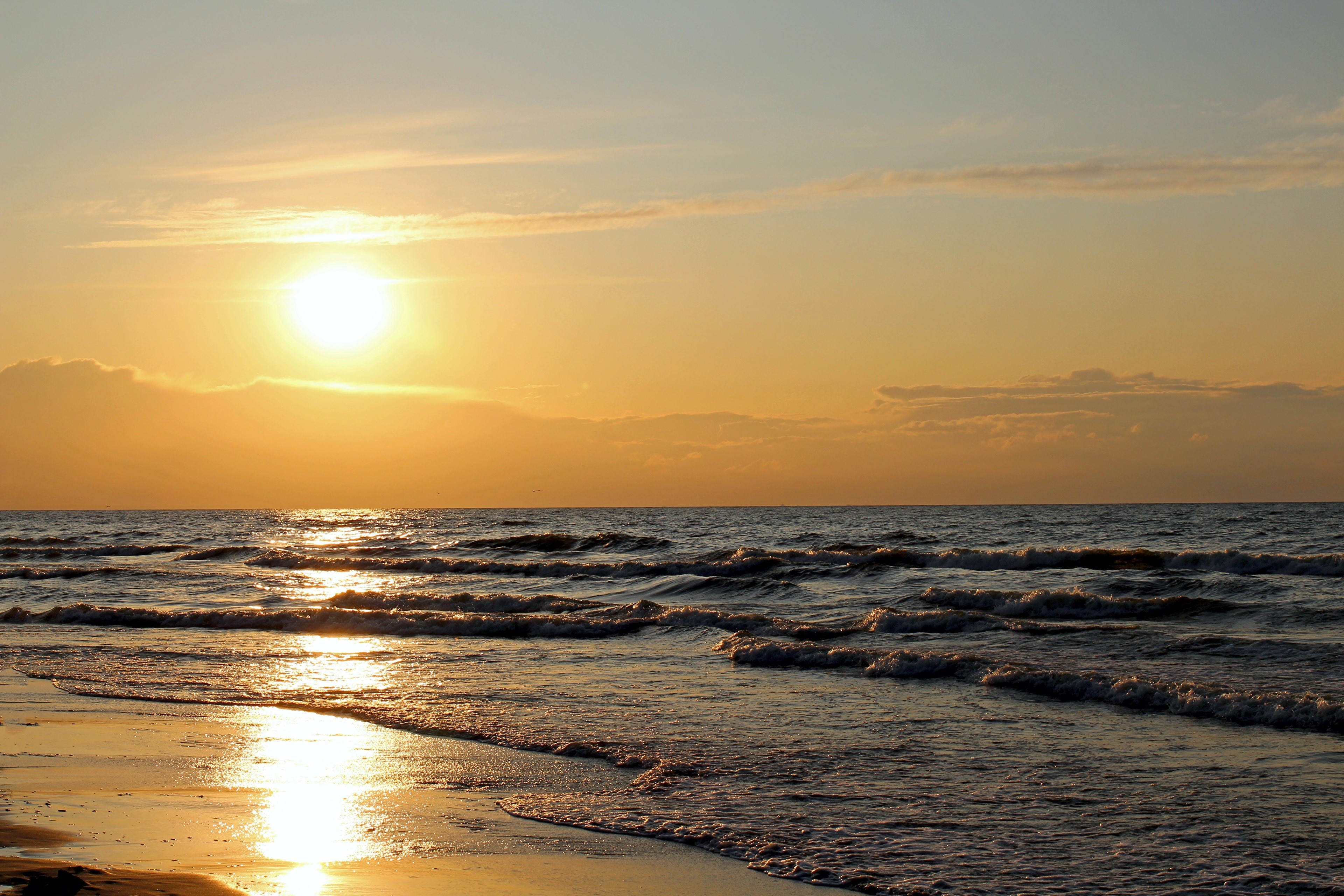 Sunset over the sea with waves HD Wallpaper