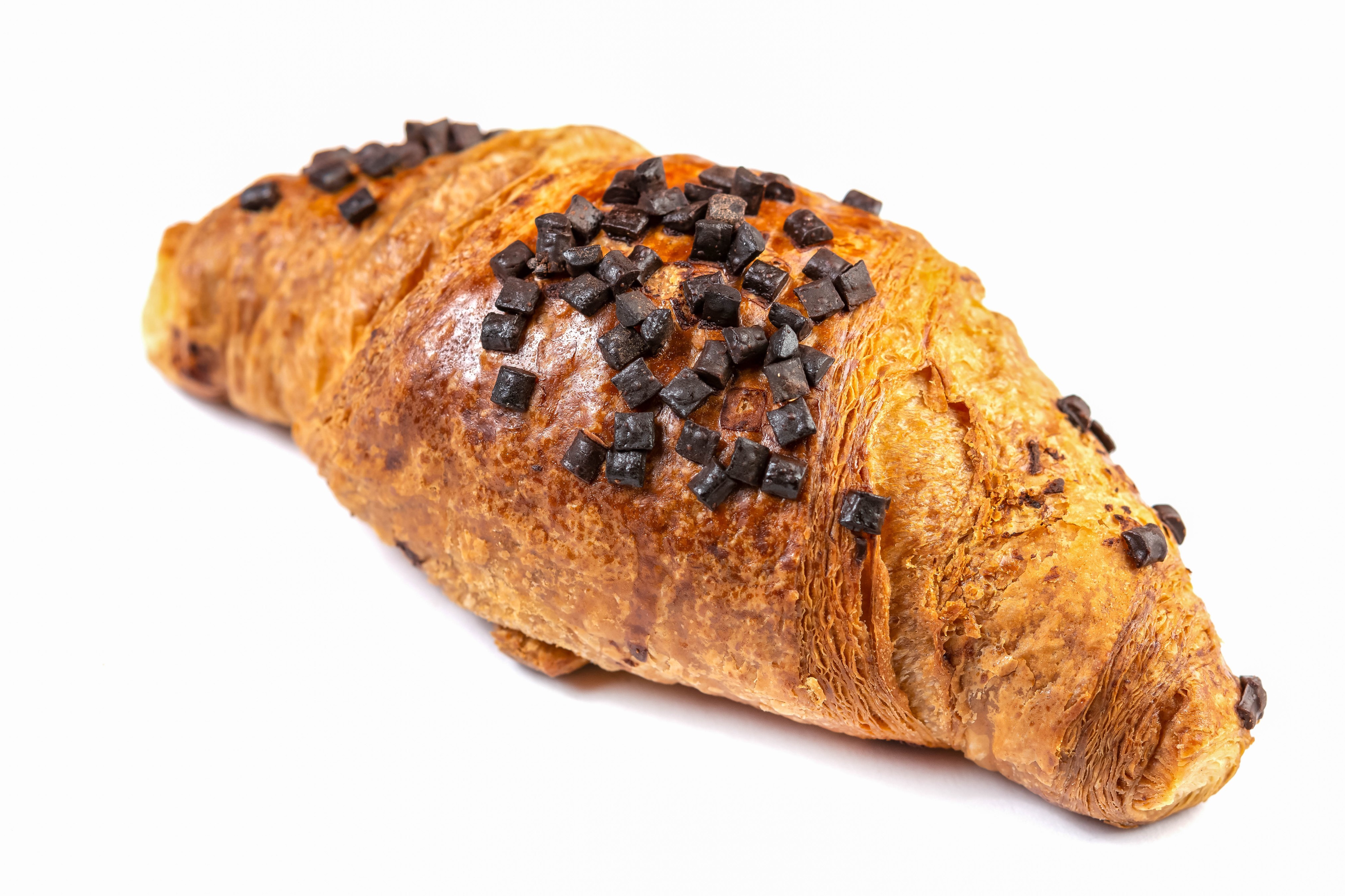 Chocolate Croissant with Chocolate Chips on White Background HD Wallpaper