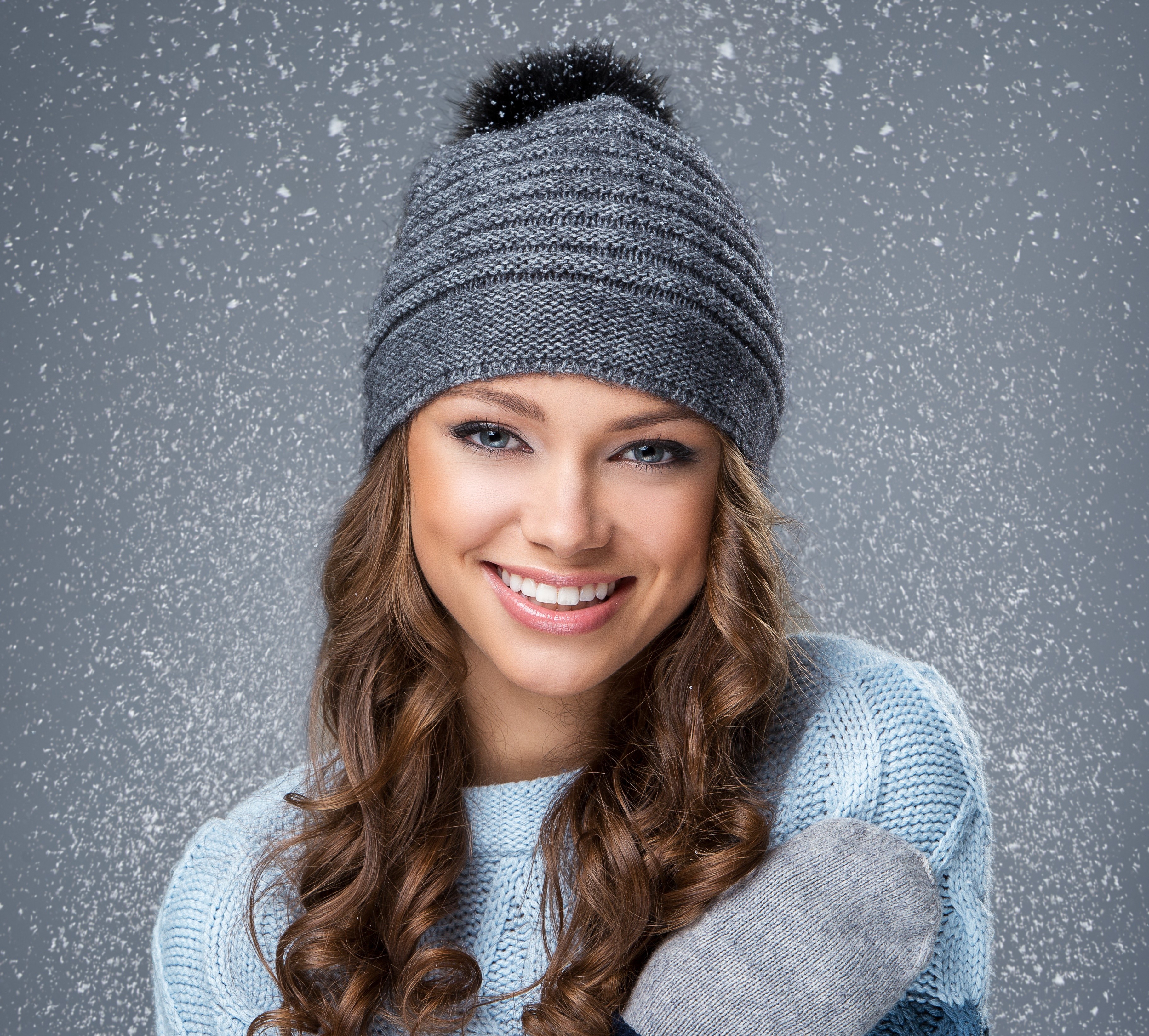 Woman in winter hat and sweater with snow HD Wallpaper