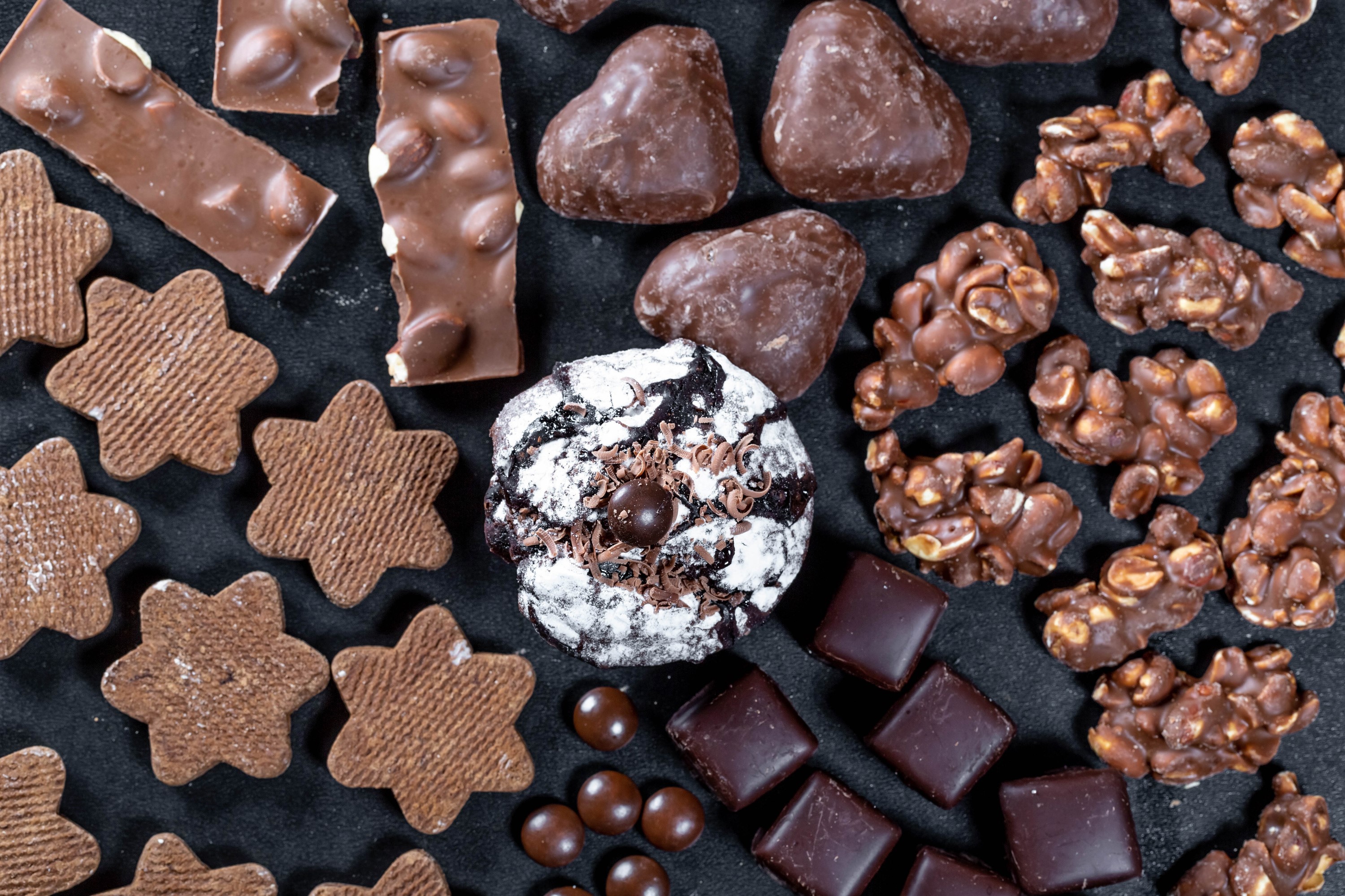 Assortment of chocolate candies and cookies HD Wallpaper