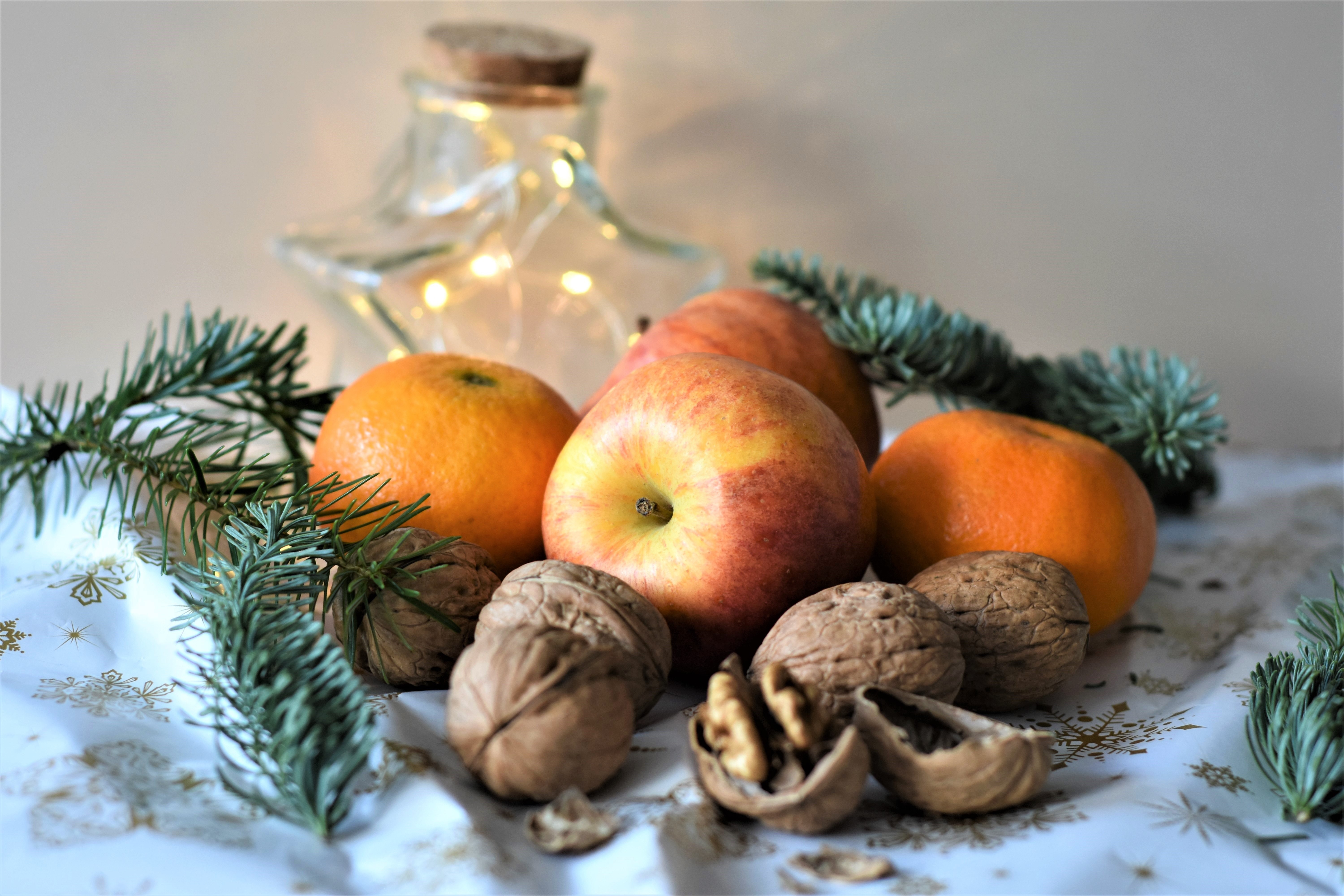Still-life with apples, mandarins, nuts, and Christmas decorations HD Wallpaper