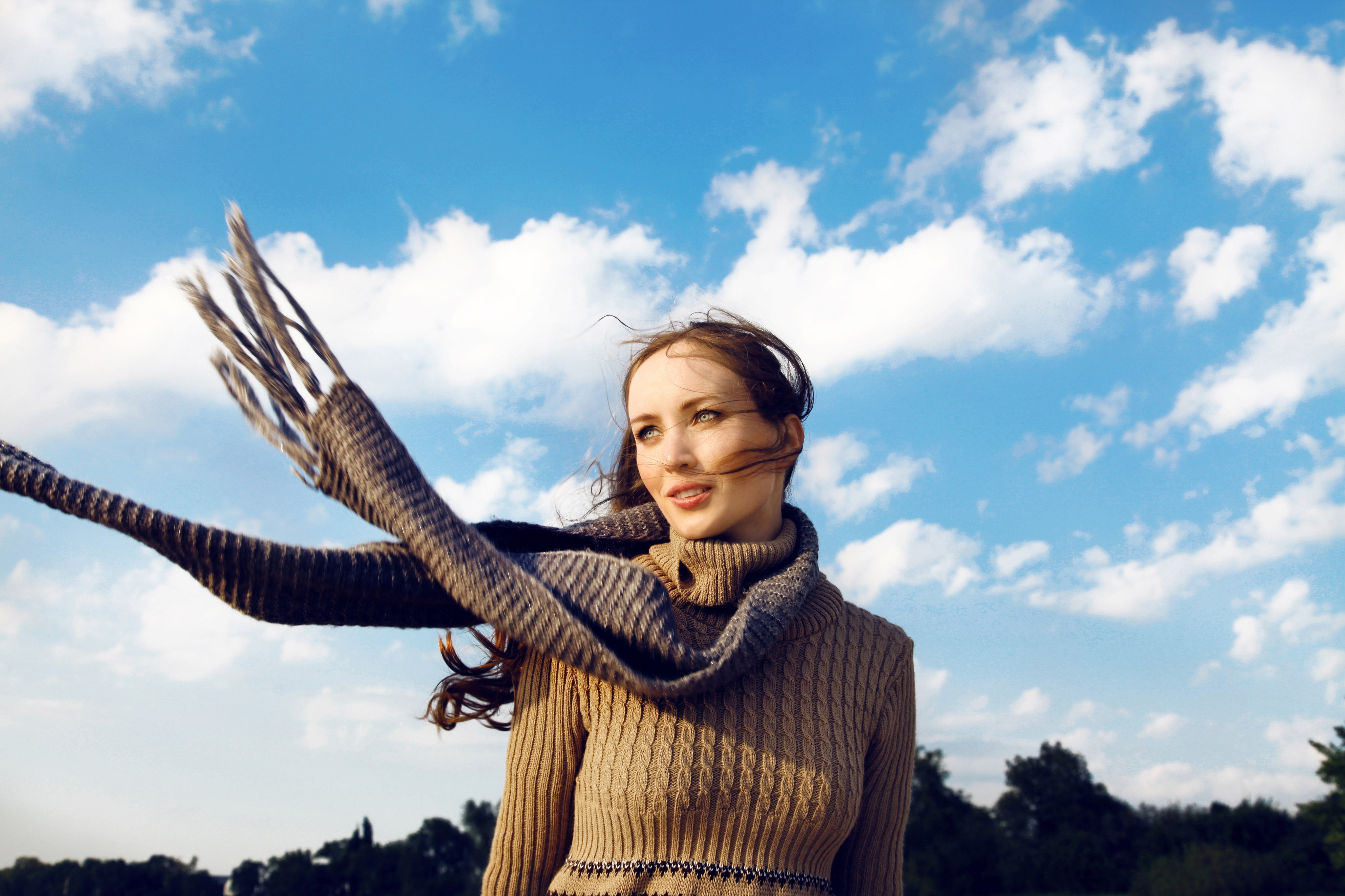 Woman with scarf in the wind under blue sky HD Wallpaper