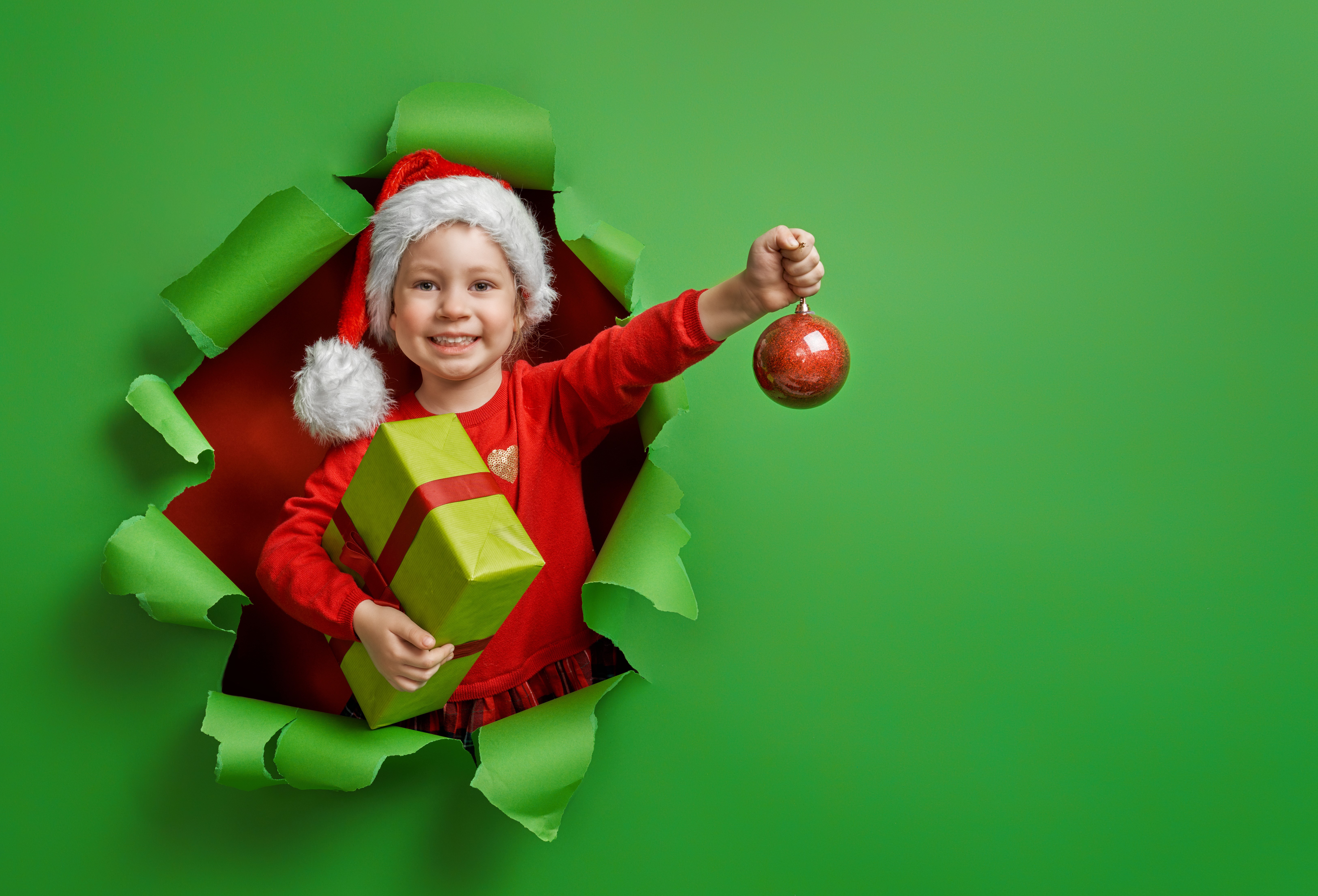 Girl in Santa hat with Christmas gifts and ornament HD Wallpaper