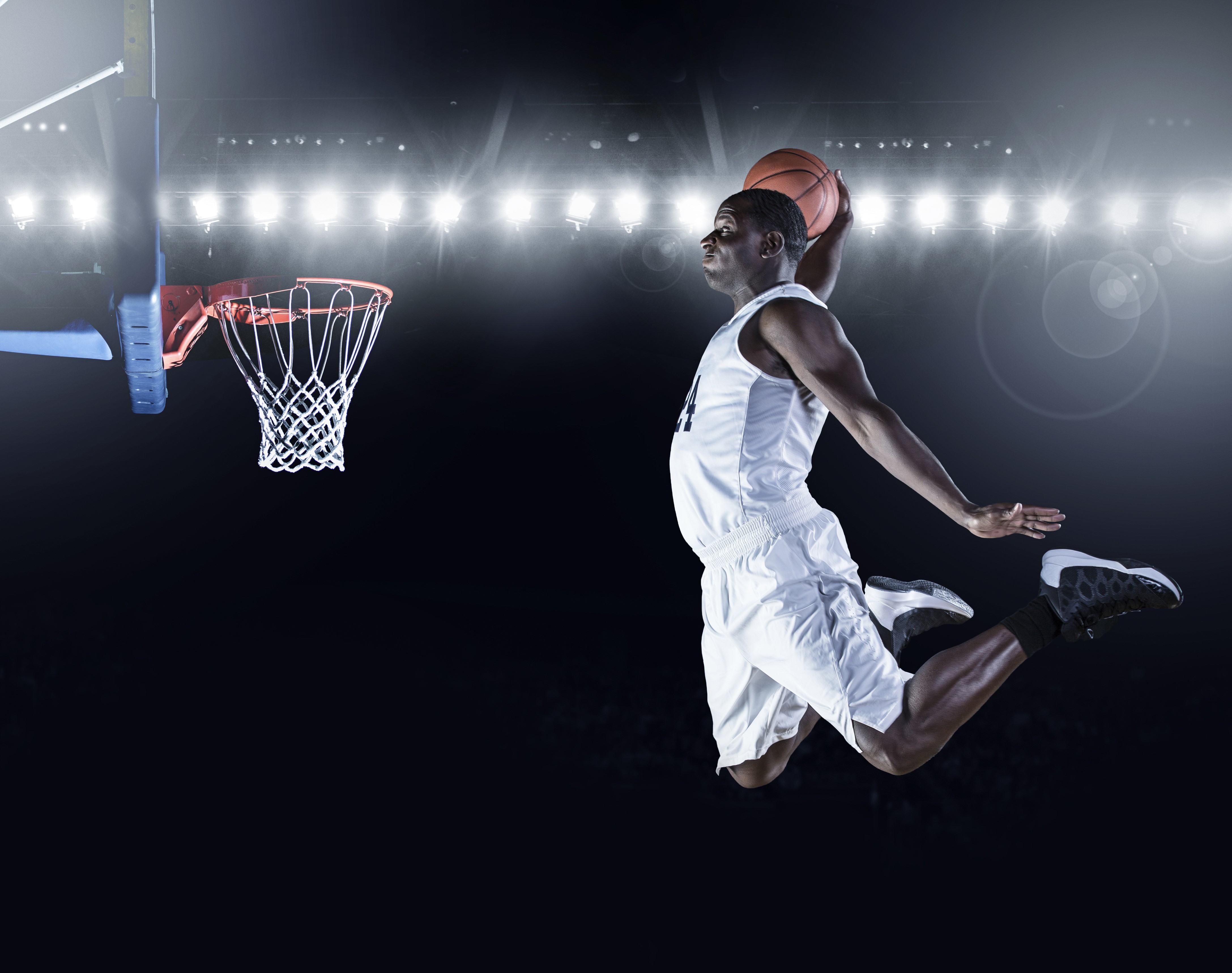 Basketball player dunking in a stadium HD Wallpaper