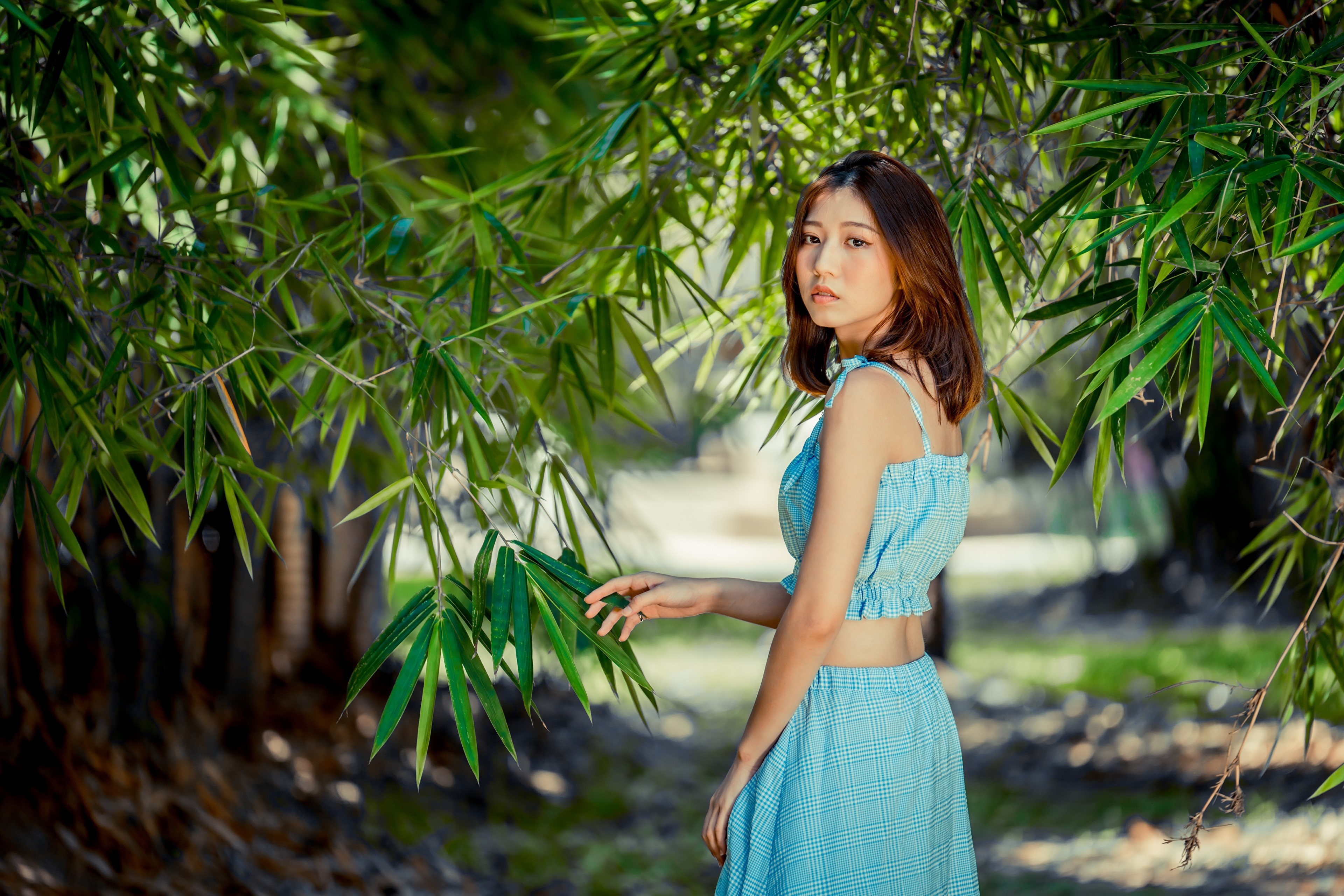 Asian woman with brown hair in a blue plaid outfit HD Wallpaper