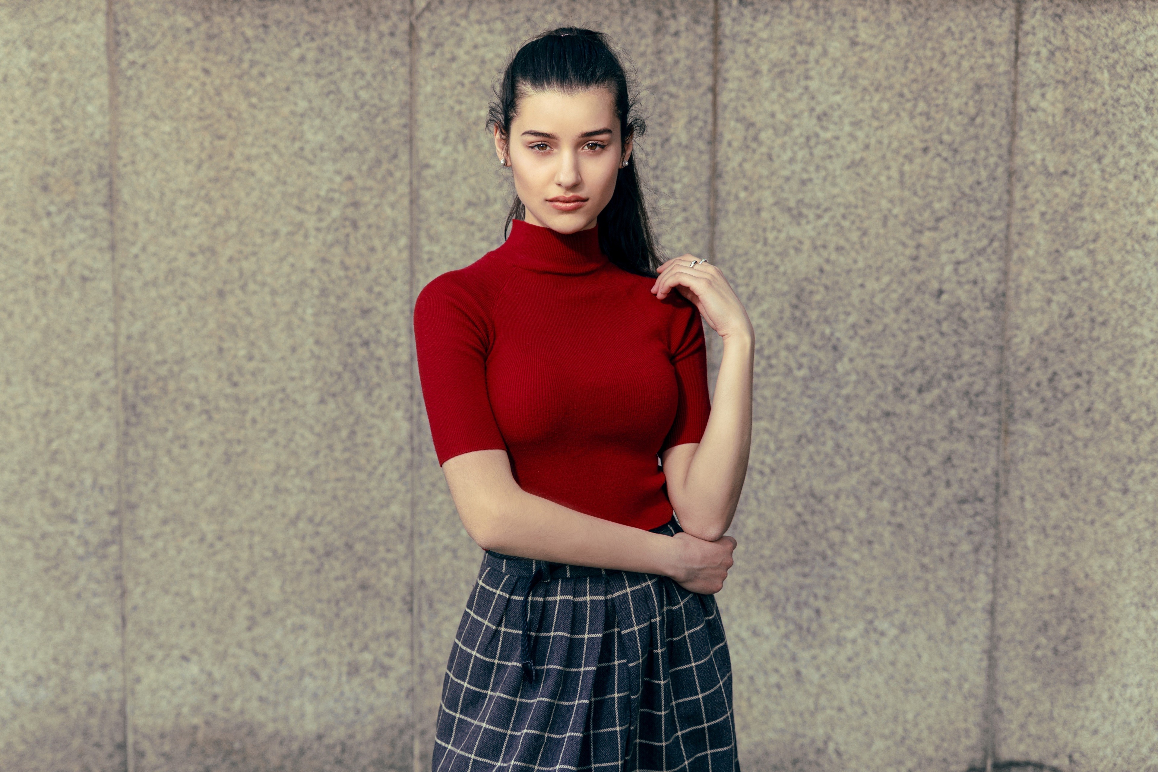 Brunette girl in red turtleneck and plaid skirt HD Wallpaper