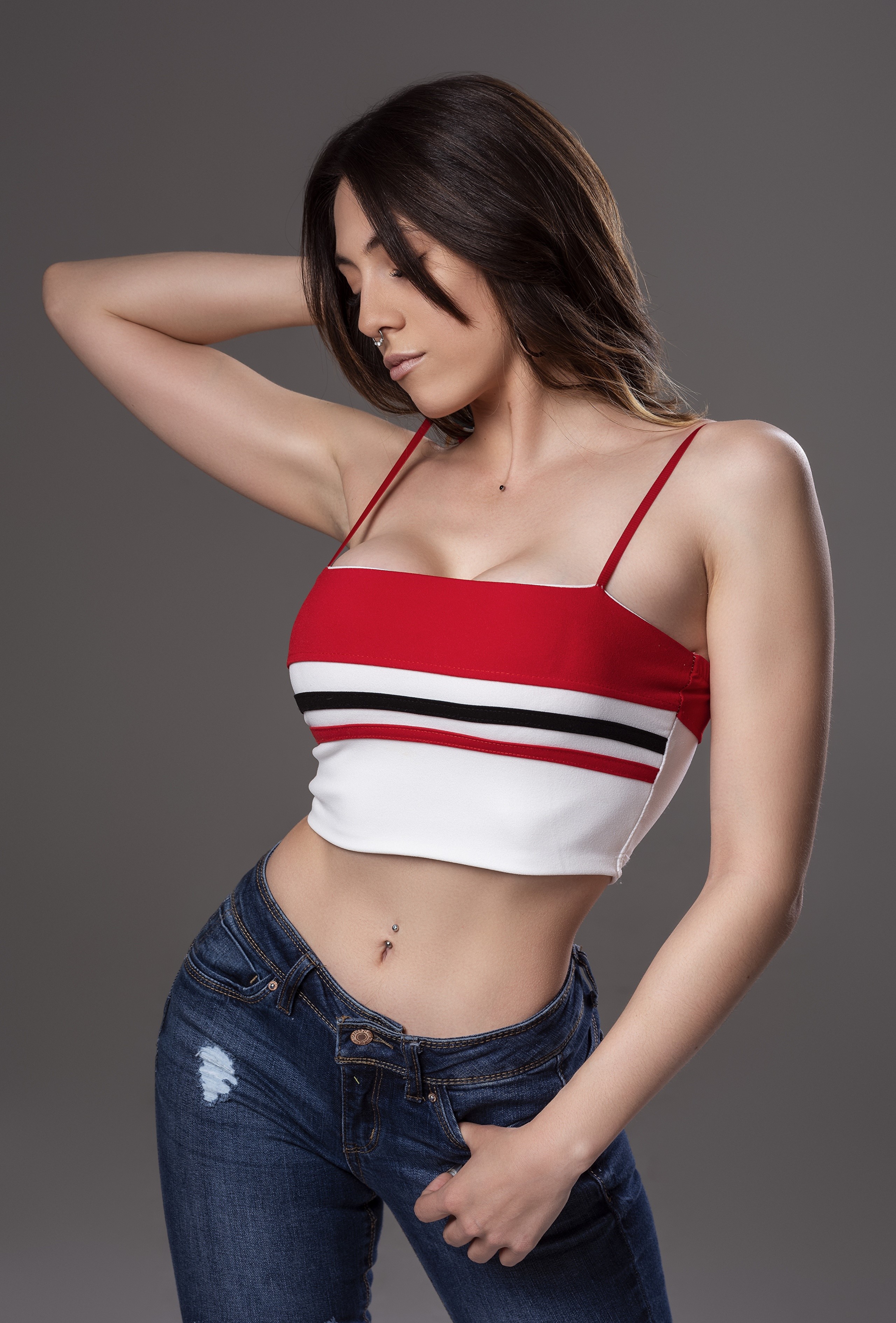 Woman in crop top and jeans posing HD Phone Wallpaper
