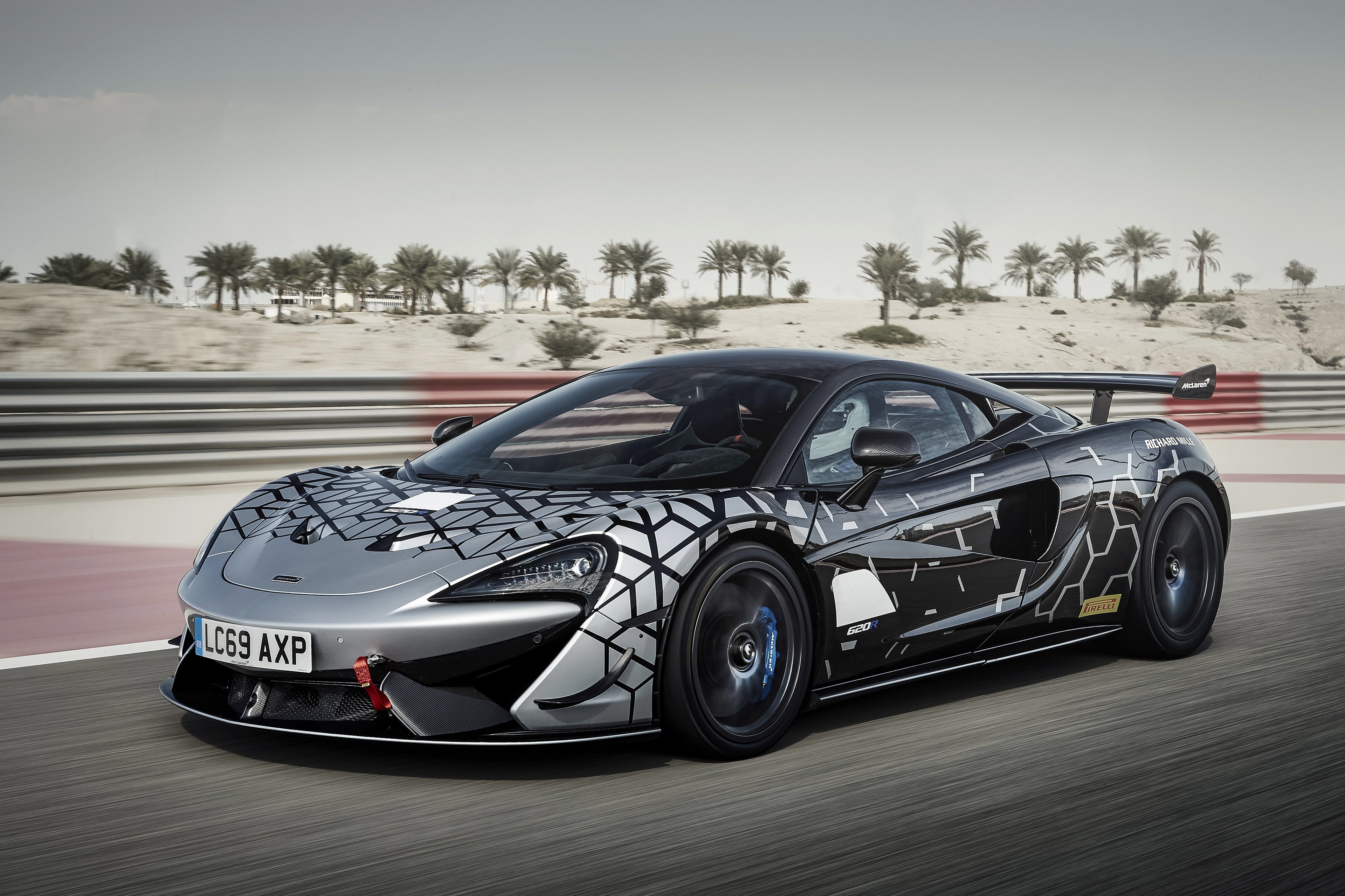 McLaren 620R V8 twin-turbo Coupe on a race track HD Wallpaper
