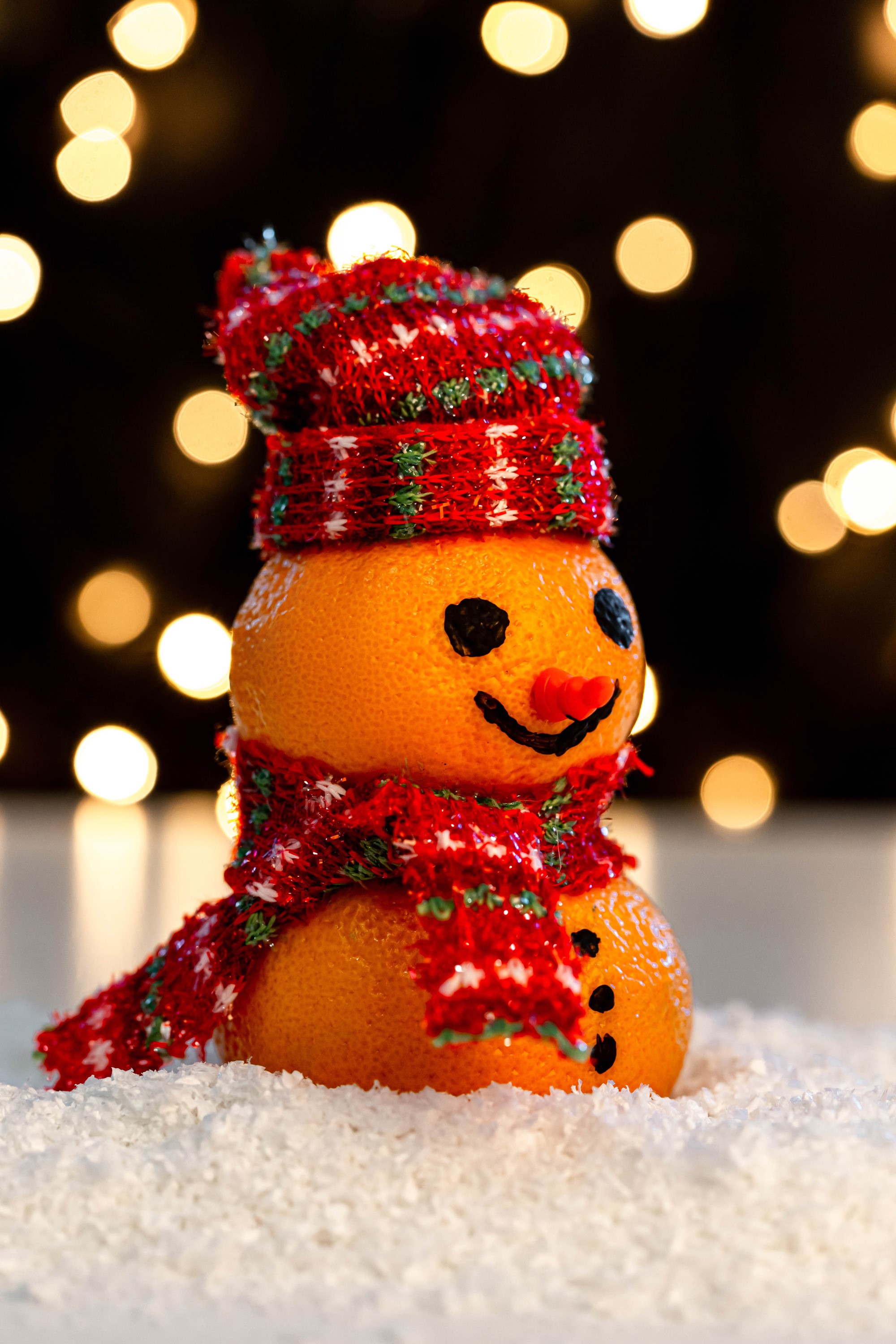 Christmas snowman made of oranges with a hat and scarf HD Phone Wallpaper