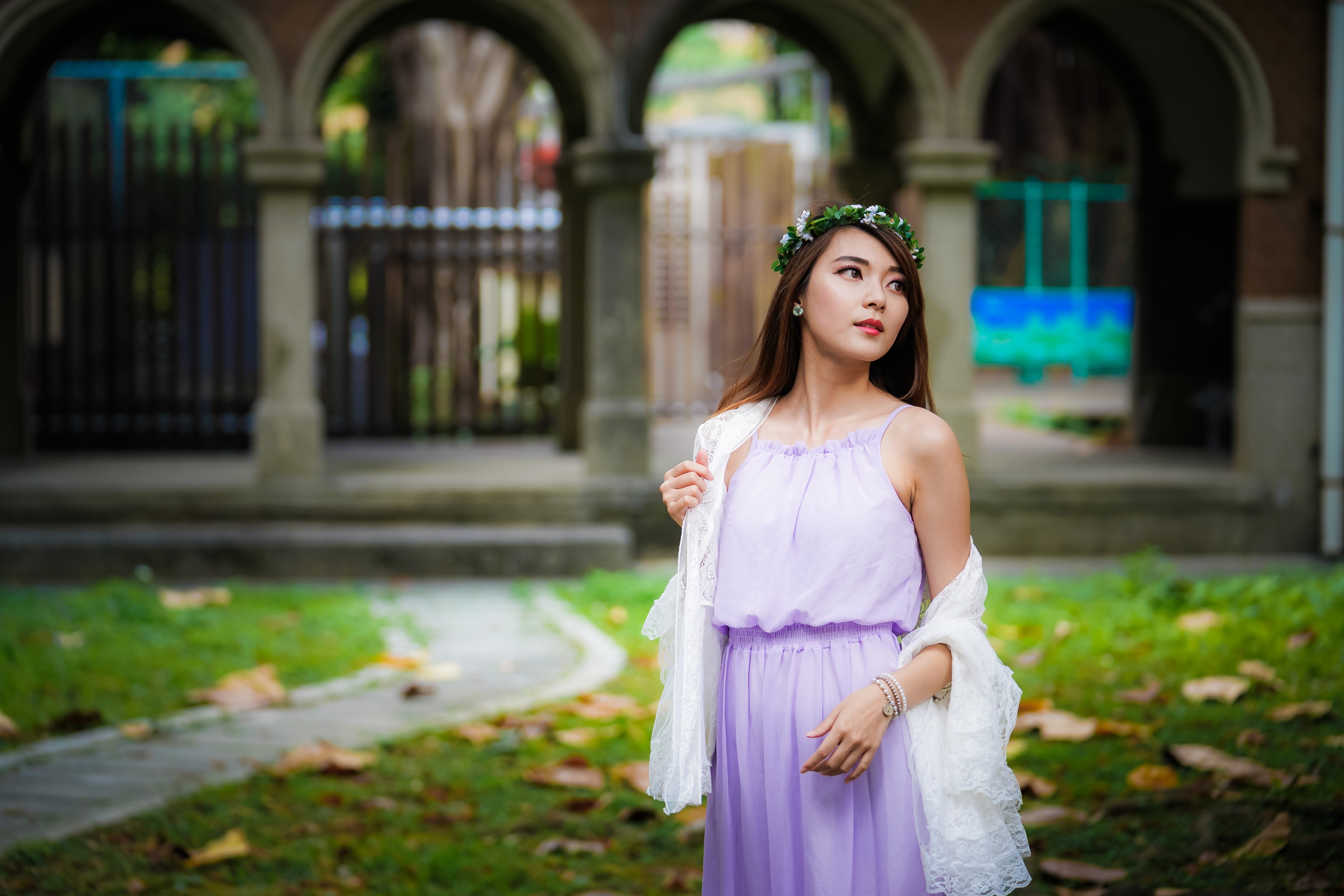 Asian woman with flower wreath in a garden HD Wallpaper