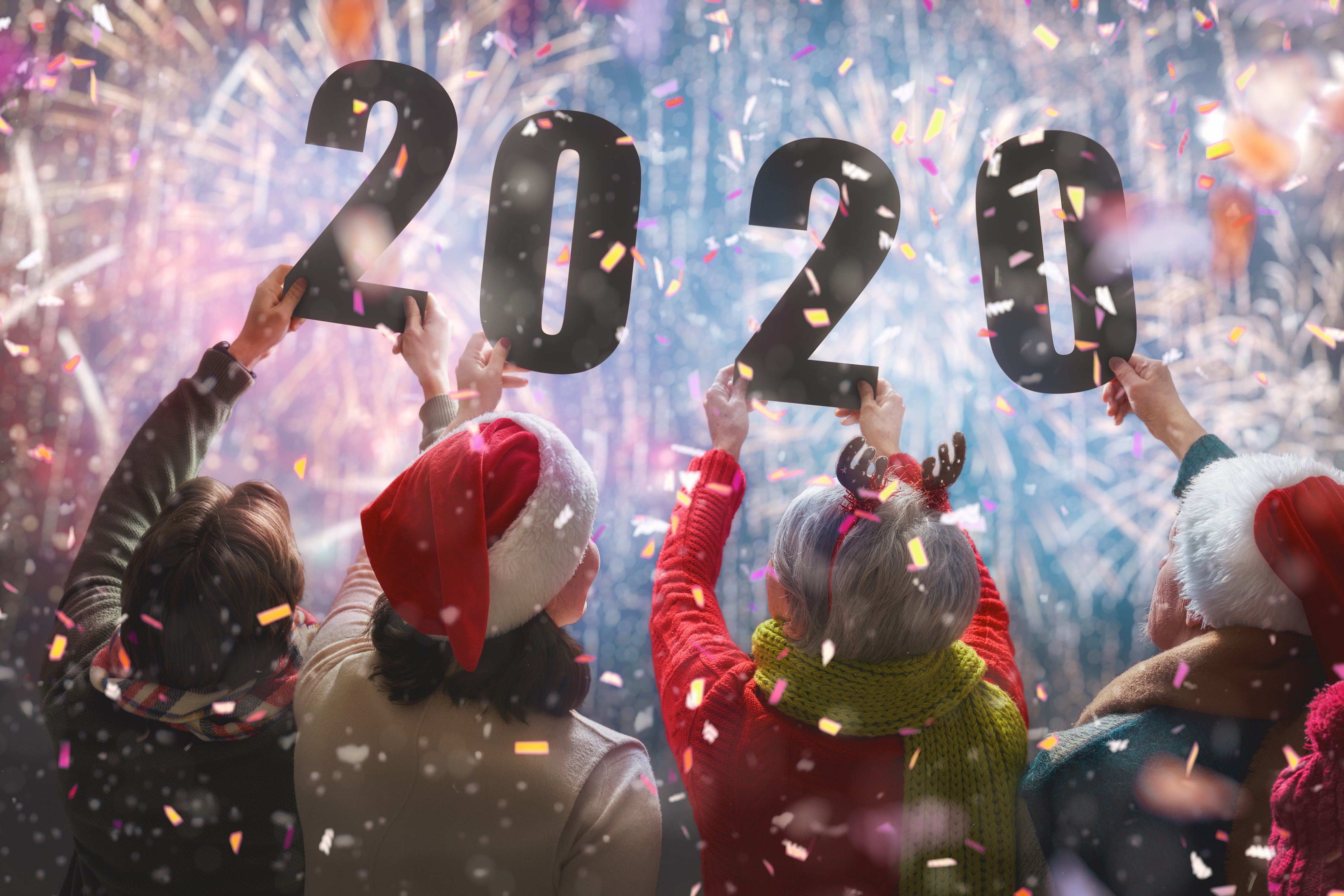 People holding 2020 numbers with fireworks HD Wallpaper