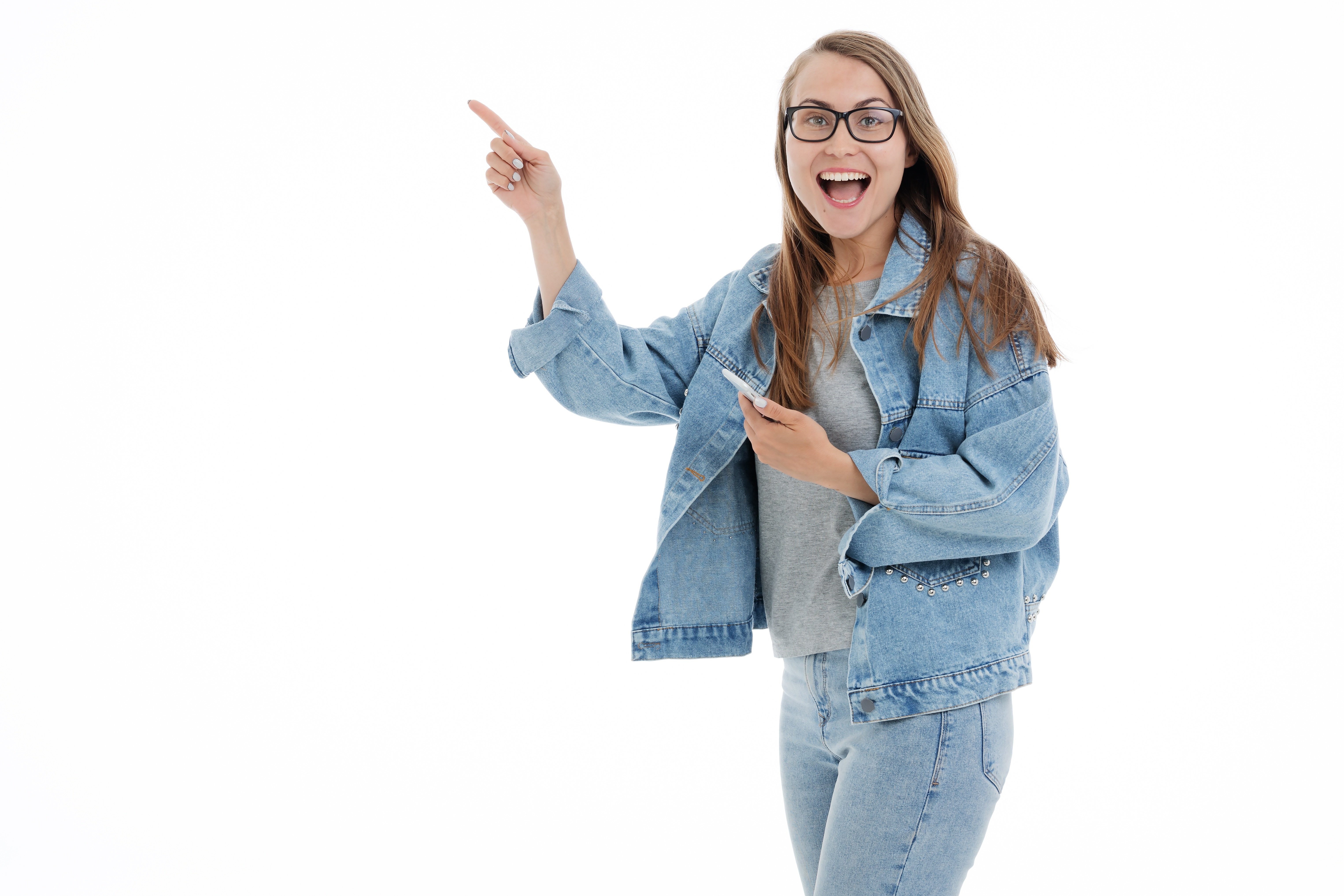 Woman in denim jacket and glasses pointing HD Wallpaper