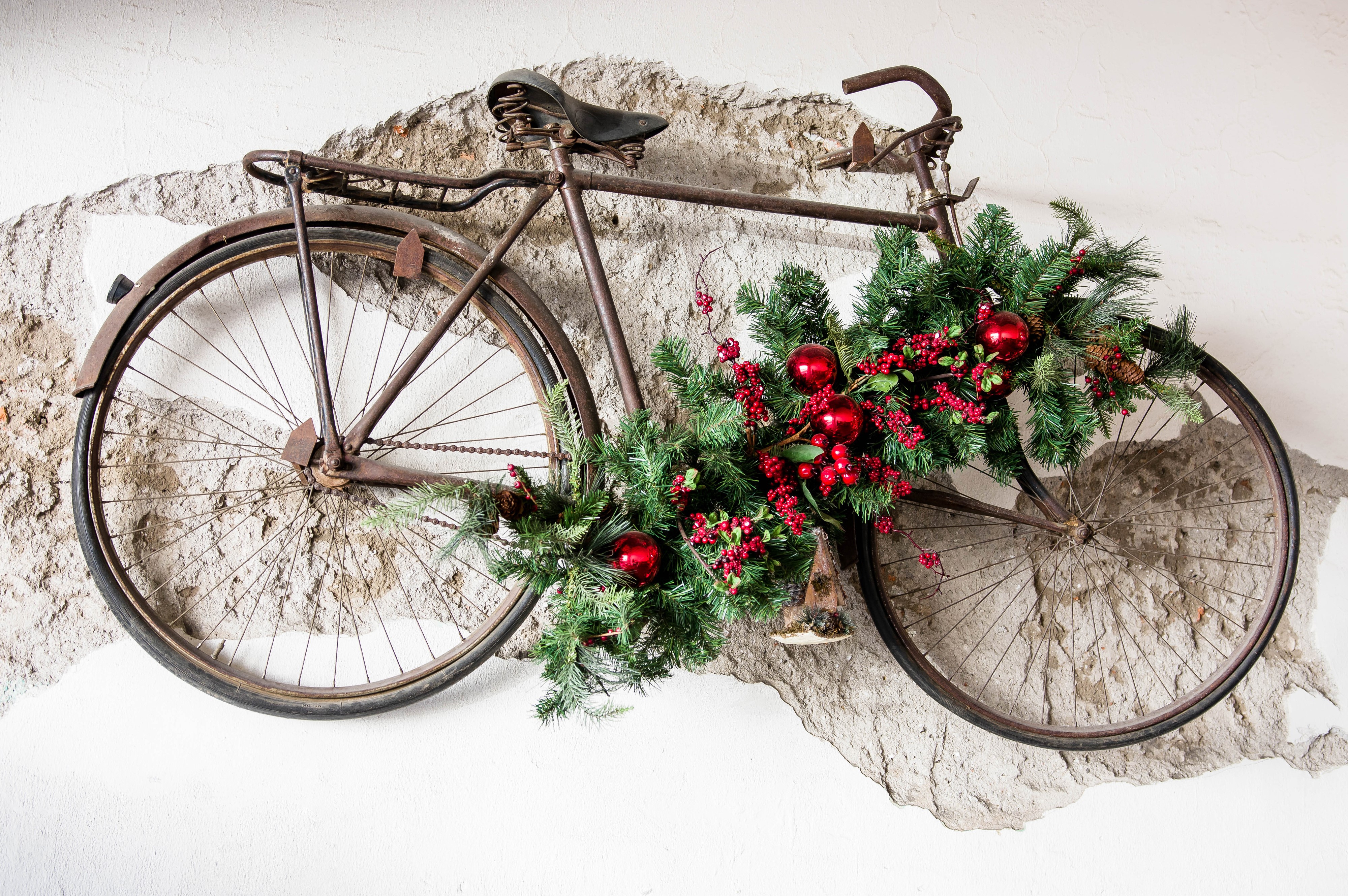 Christmas decorated vintage bicycle on a textured wall HD Wallpaper