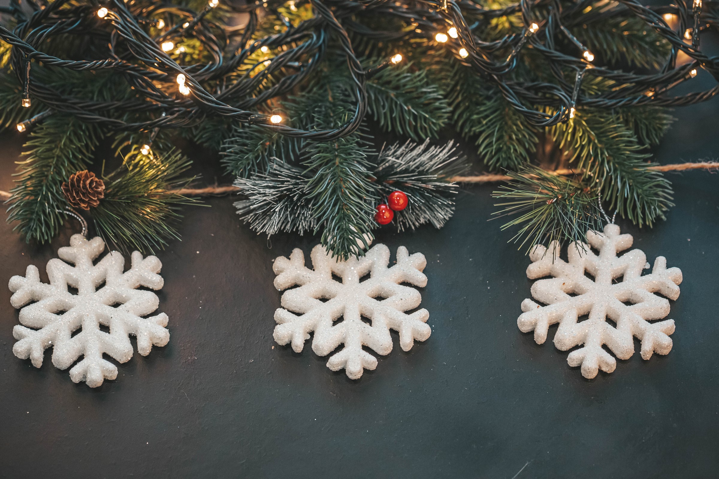 Christmas pine branches with snowflakes and fairy lights HD Wallpaper