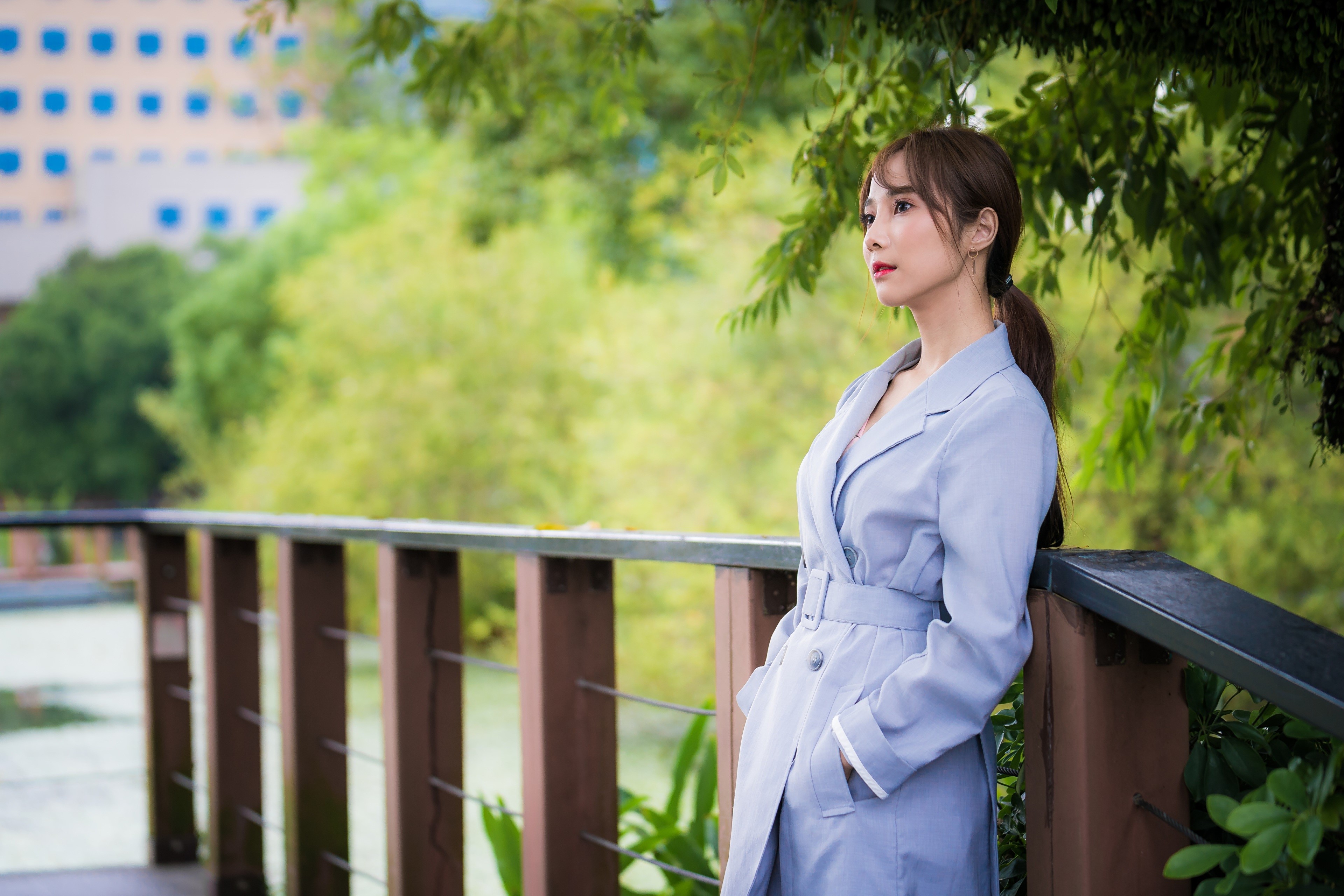 Asian woman in a light blue cloak outdoors HD Wallpaper
