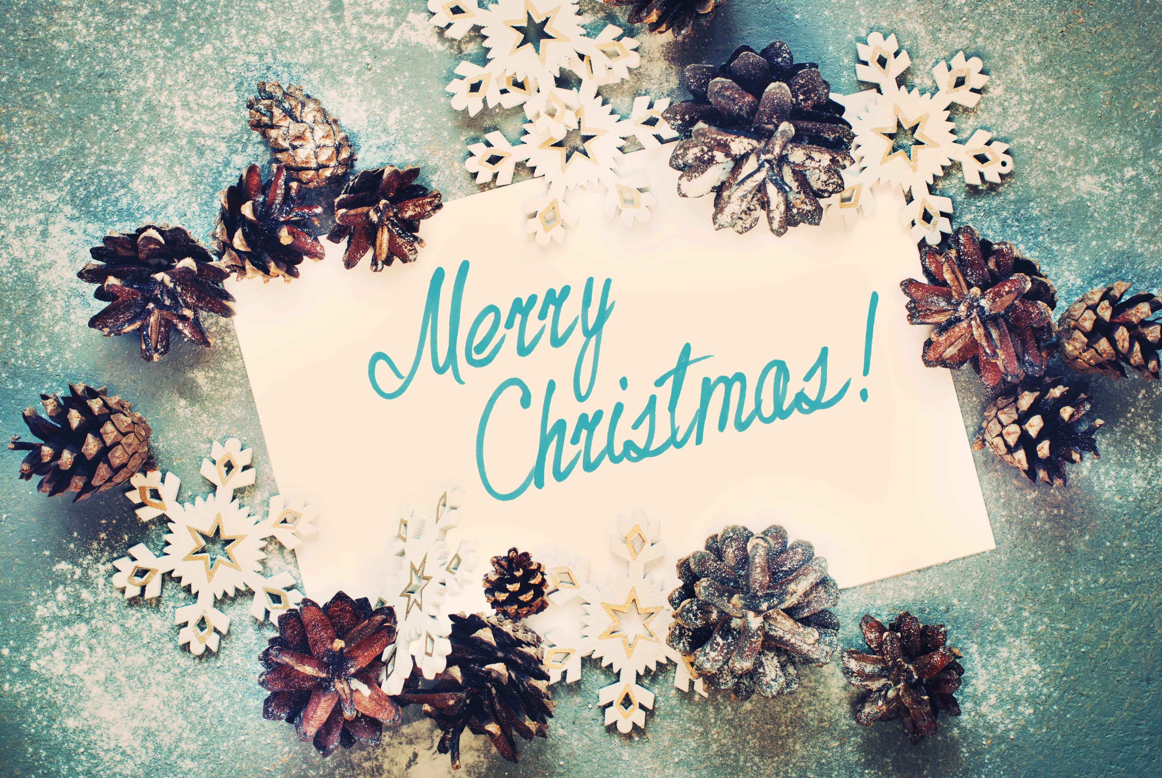 Merry Christmas card with pine cones and snowflakes HD Wallpaper