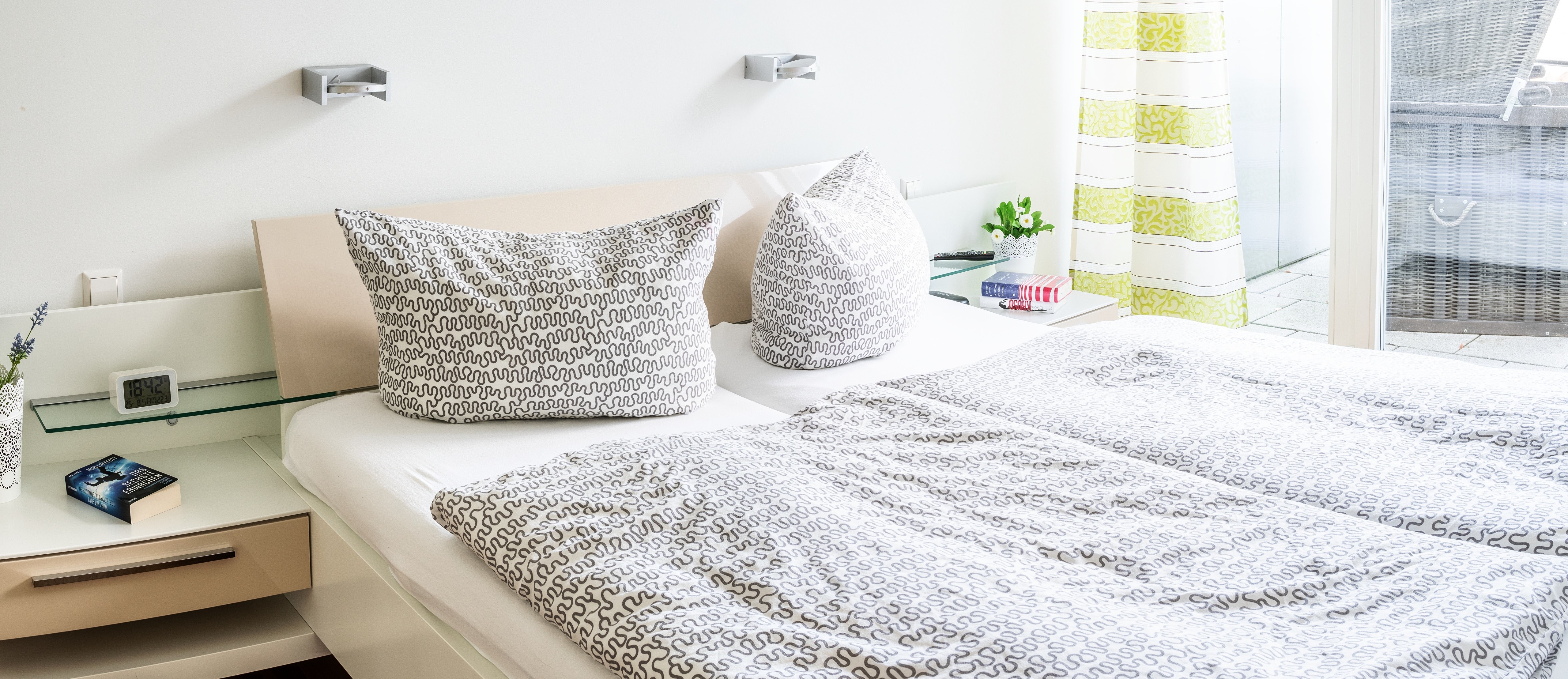 Bedroom with a bed and pillows HD Wallpaper
