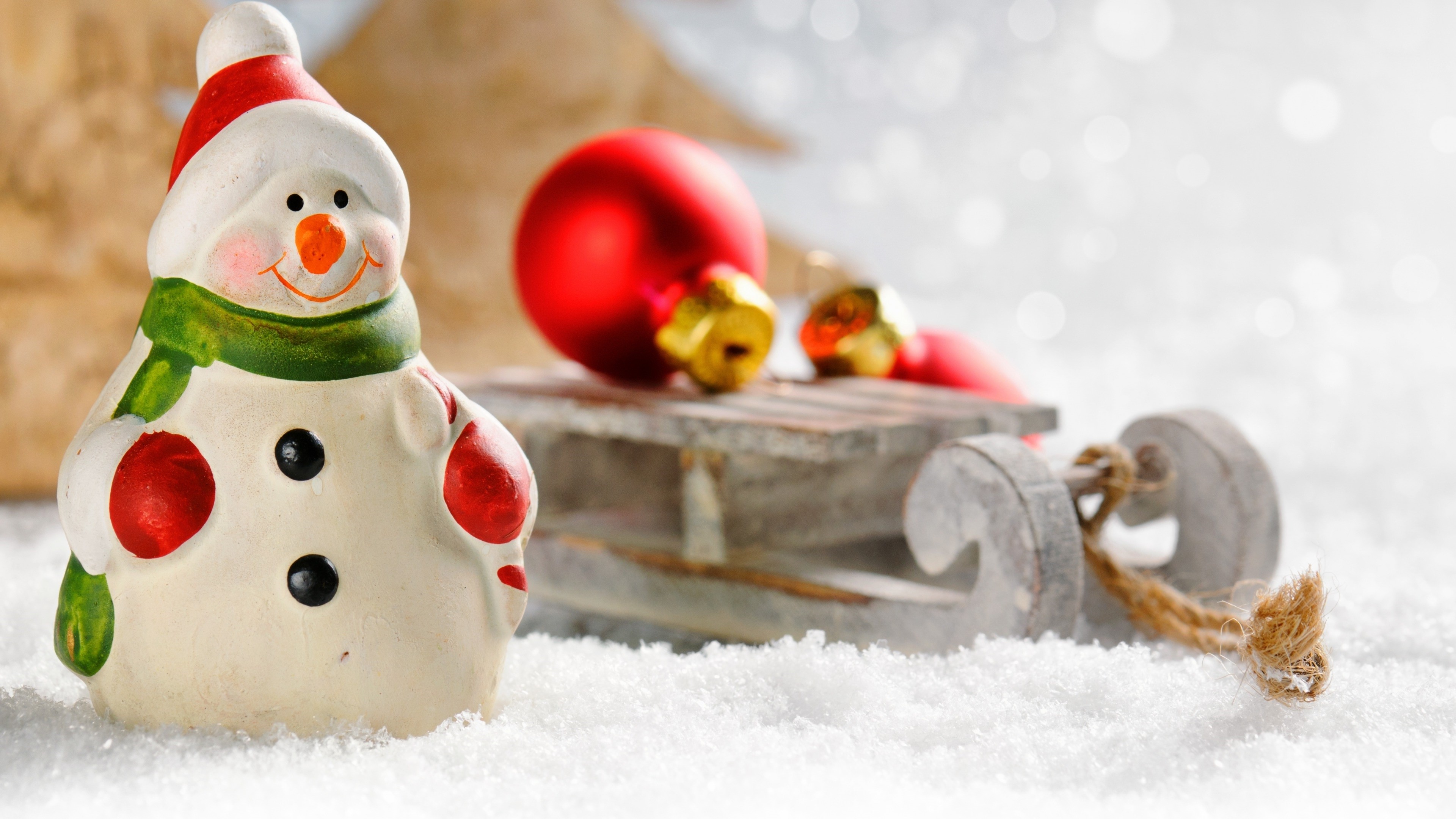 4K Christmas Snowman Toy with Sled and Ornaments HD Wallpaper