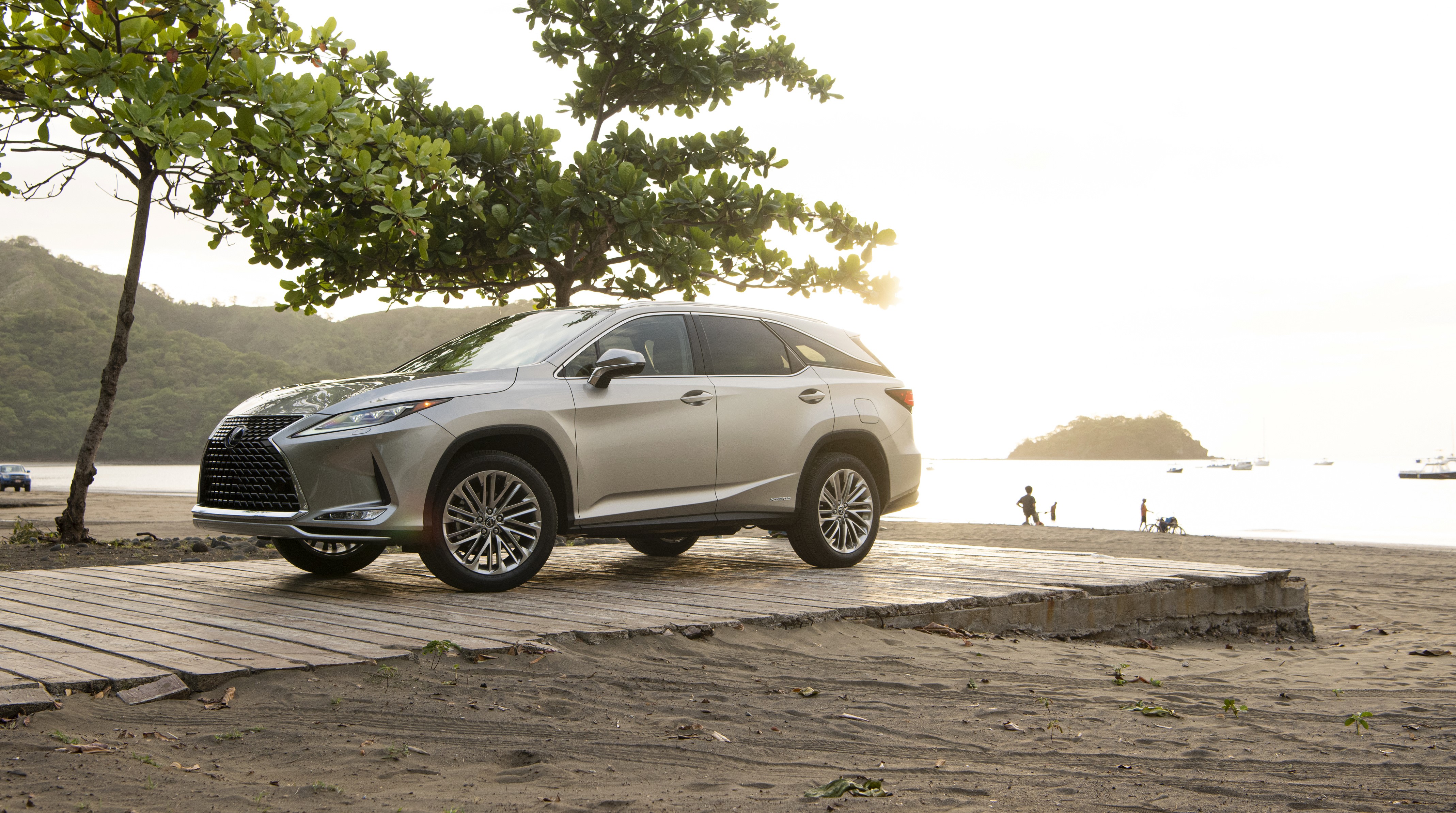 2020 Lexus RX 450hL on a beach boardwalk HD Wallpaper
