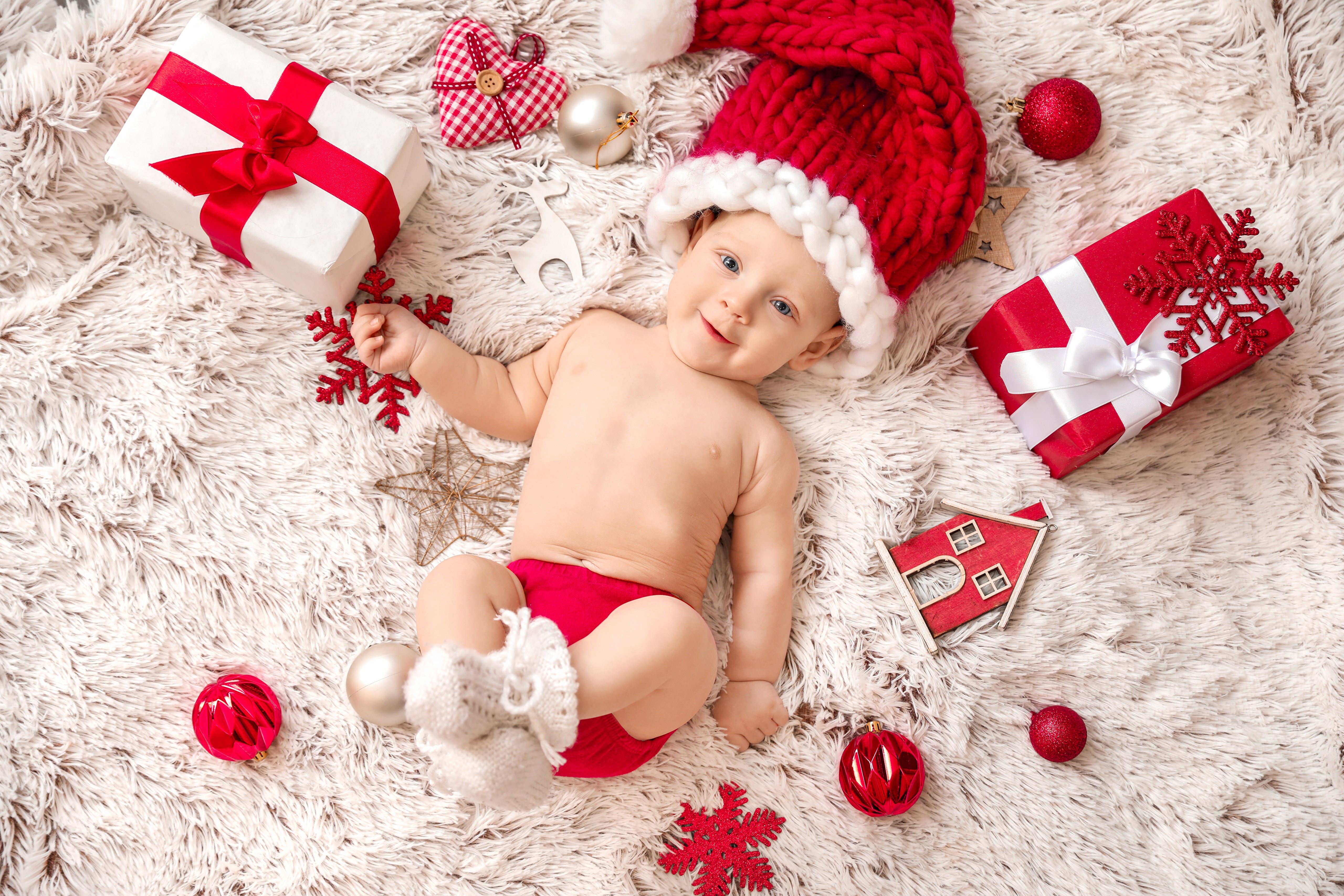 Baby in Santa hat with Christmas gifts HD Wallpaper