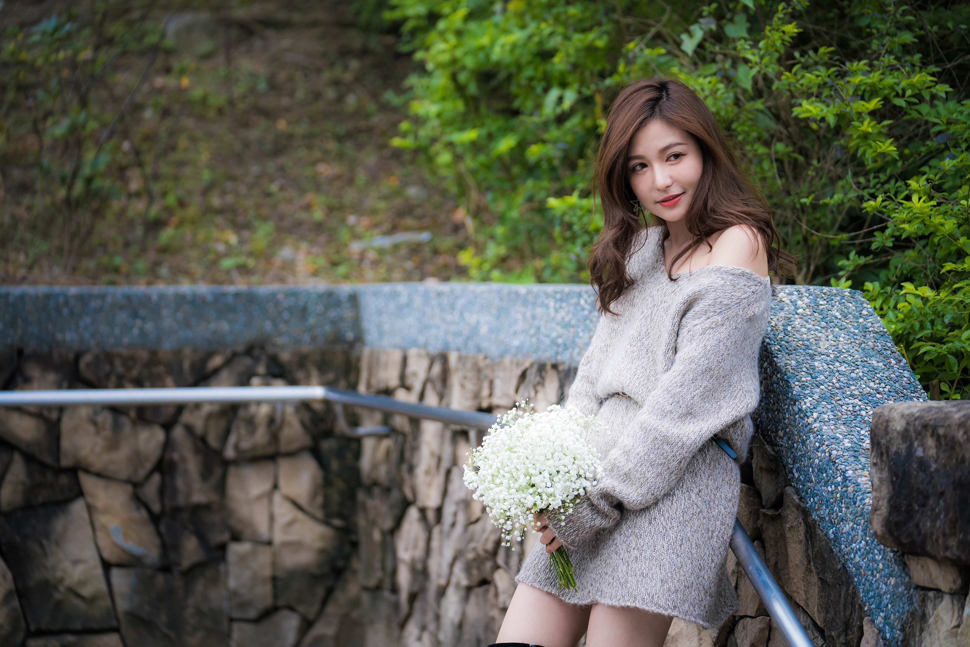 Asian woman with brown hair holding a bouquet HD Wallpaper