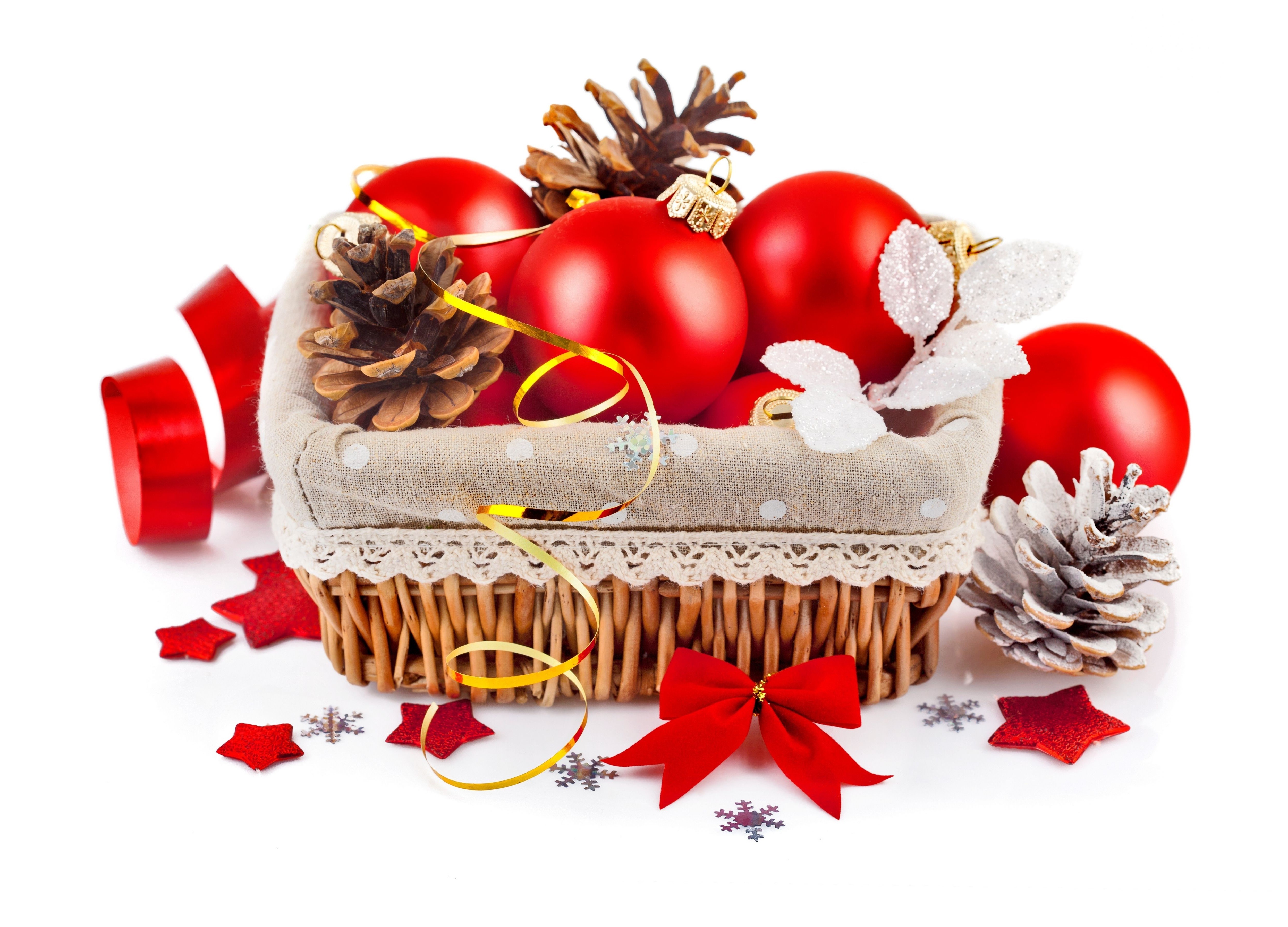 Christmas ornaments in a wicker basket with pine cones and ribbon HD Wallpaper