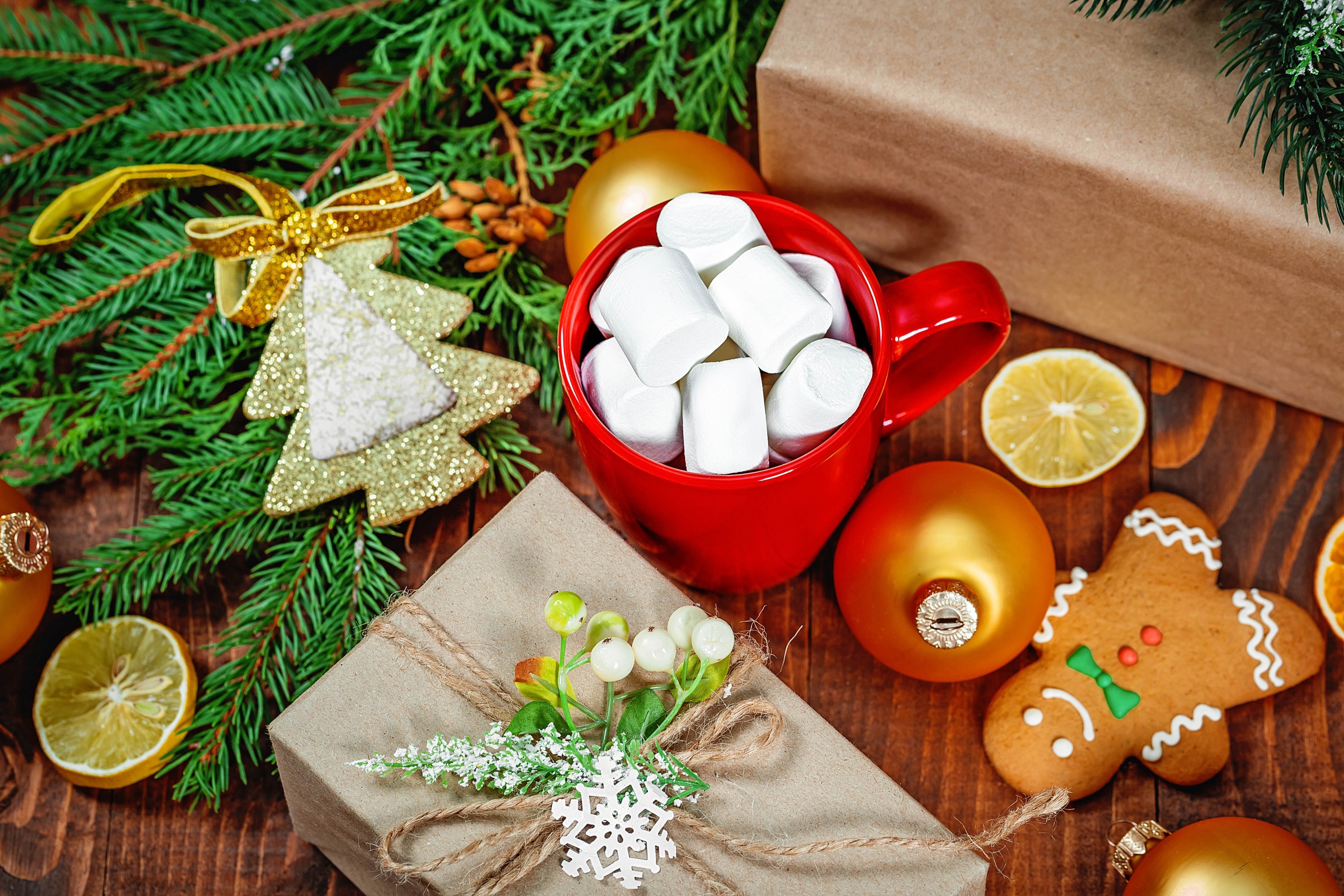 Christmas scene with gifts, hot chocolate, and gingerbread cookie HD Wallpaper