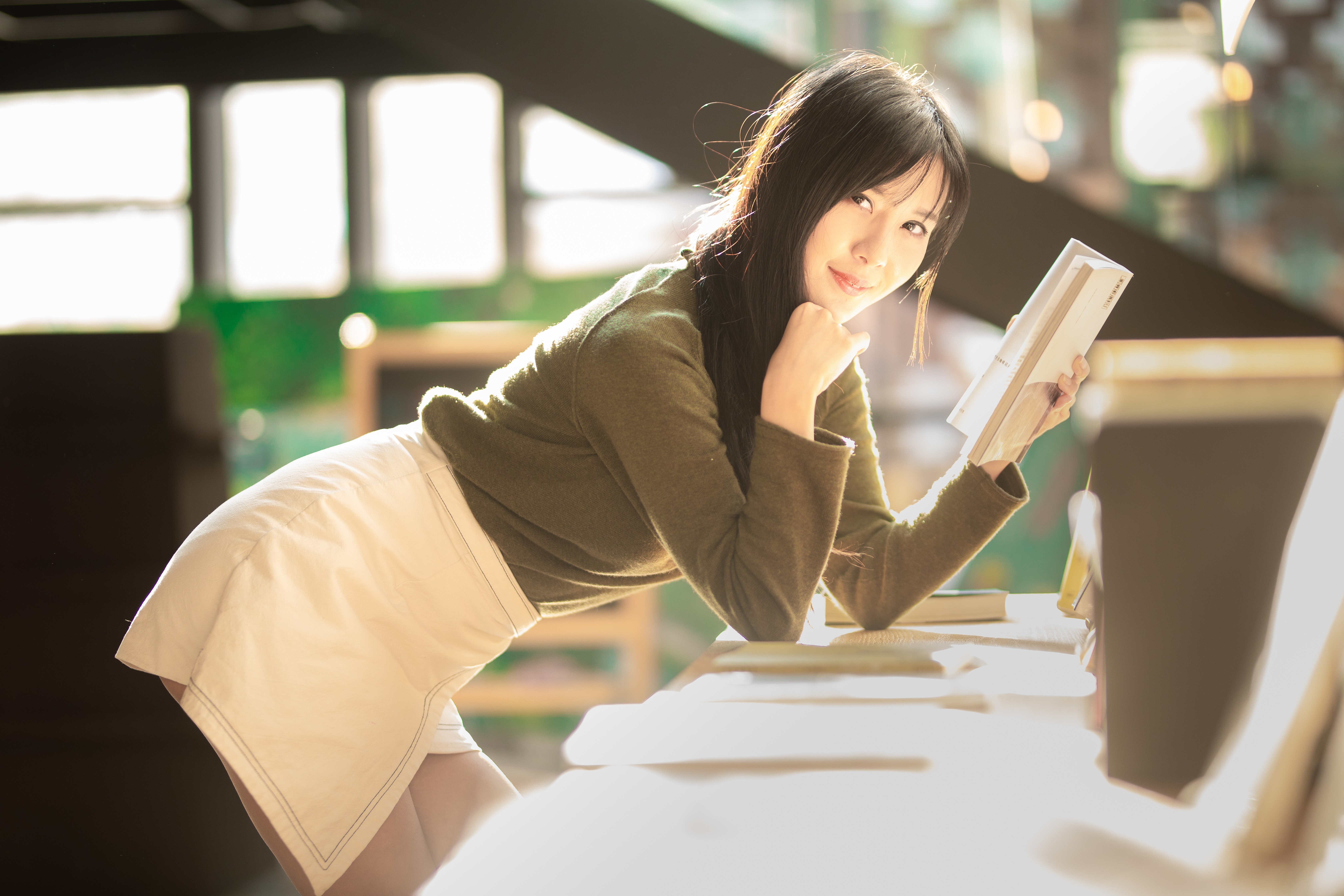 Asian Brunette Girl Reading in Soft Light 4K HD Wallpaper
