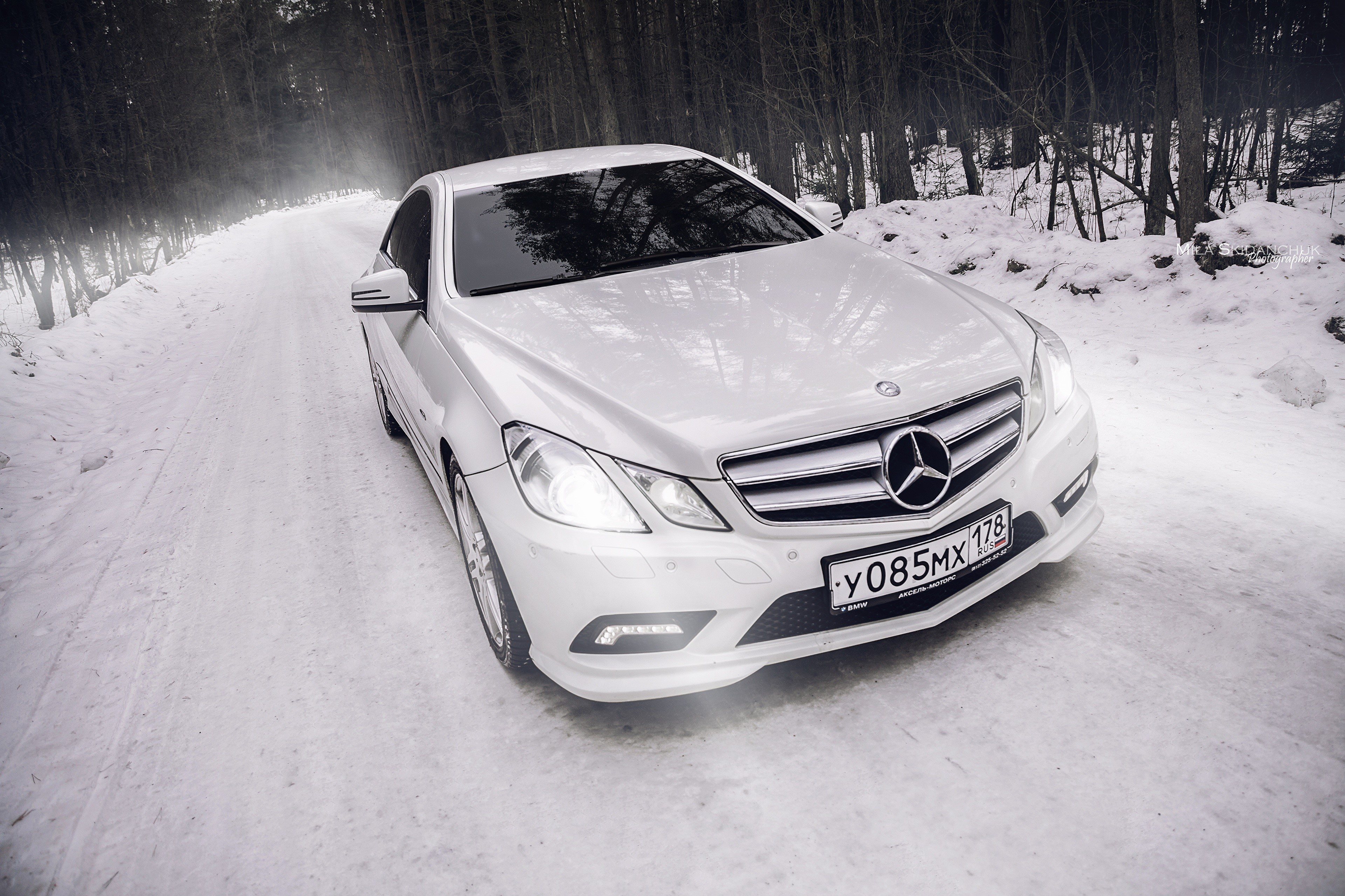 4K White Mercedes-Benz E-Class Coupe on Snowy Road HD Wallpaper