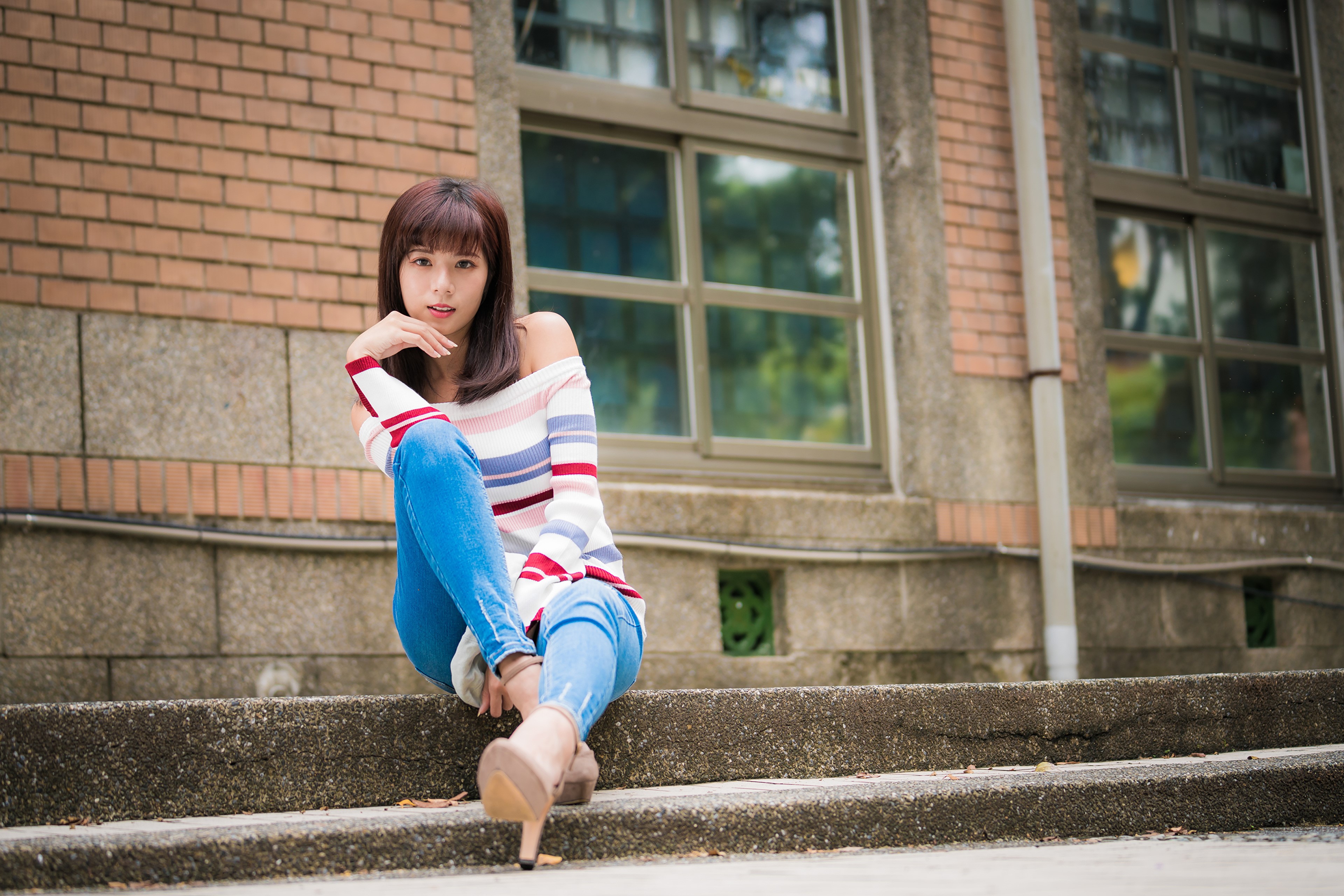 Asian woman with brown hair sitting on steps HD Wallpaper