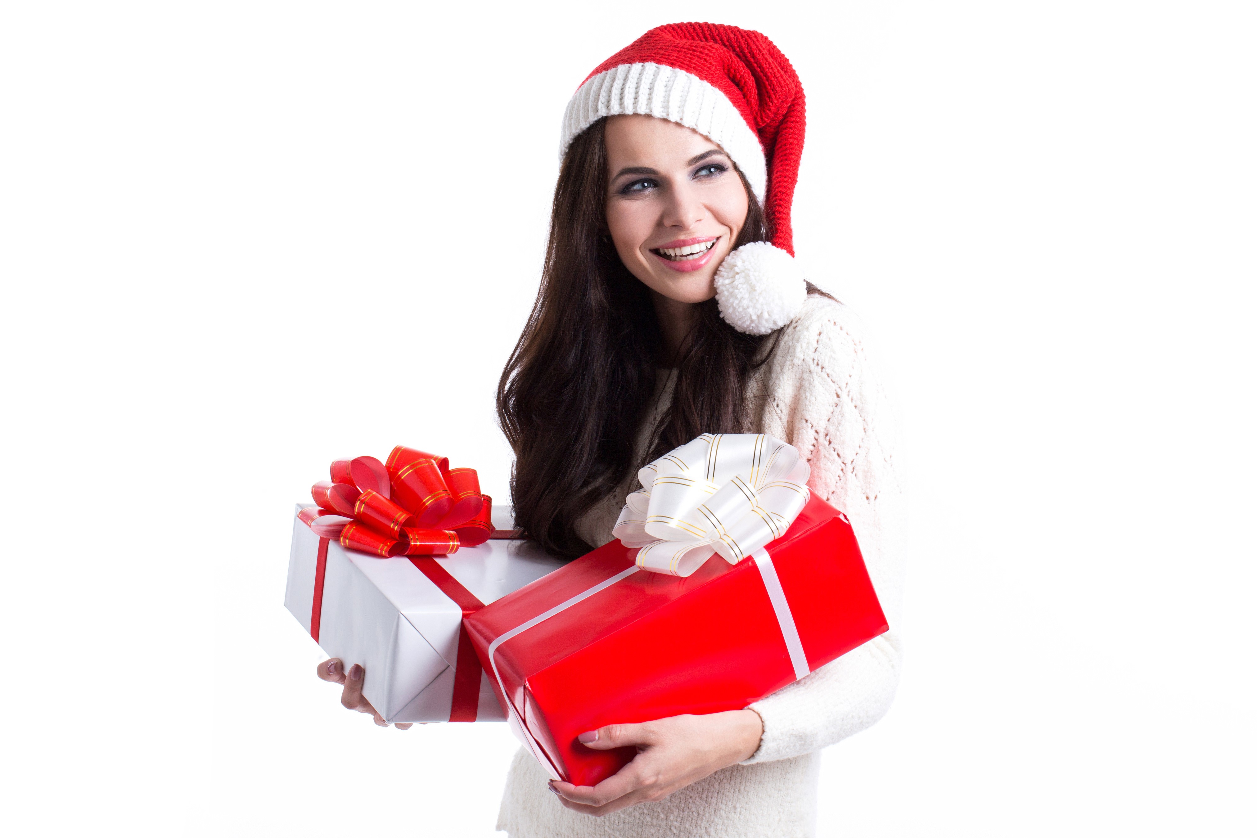 Brunette girl in Santa hat with Christmas gifts HD Wallpaper