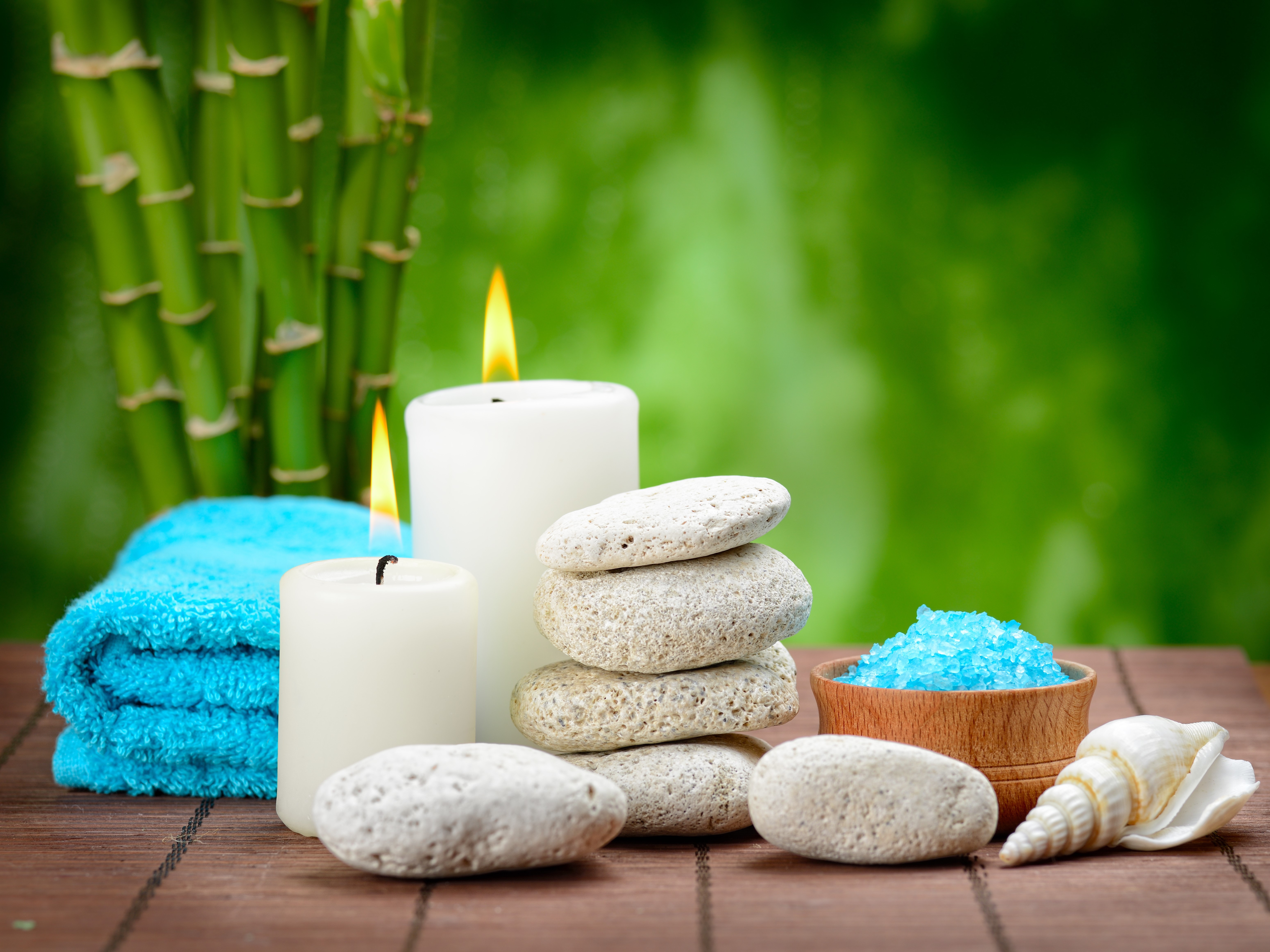 Spa setting with candles, bamboo, stones, and salt HD Wallpaper