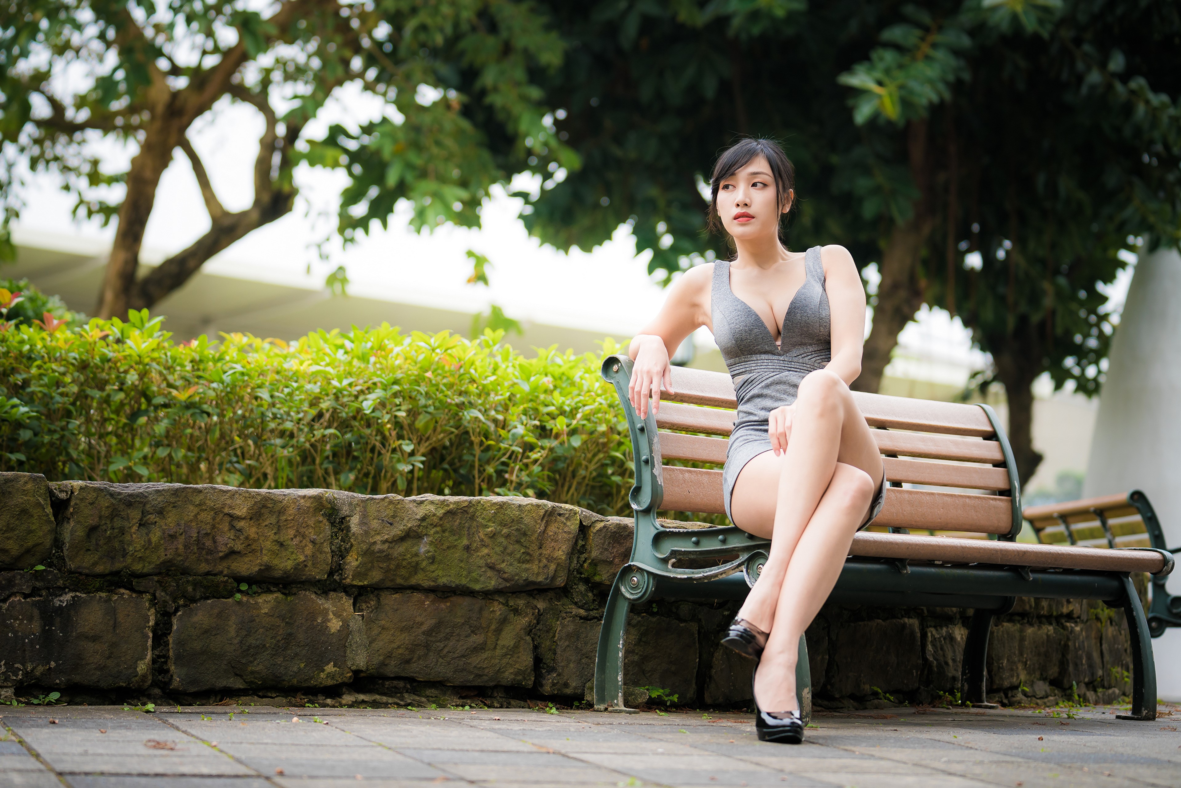 4K Asian Woman Sitting on Bench in Dress HD Wallpaper