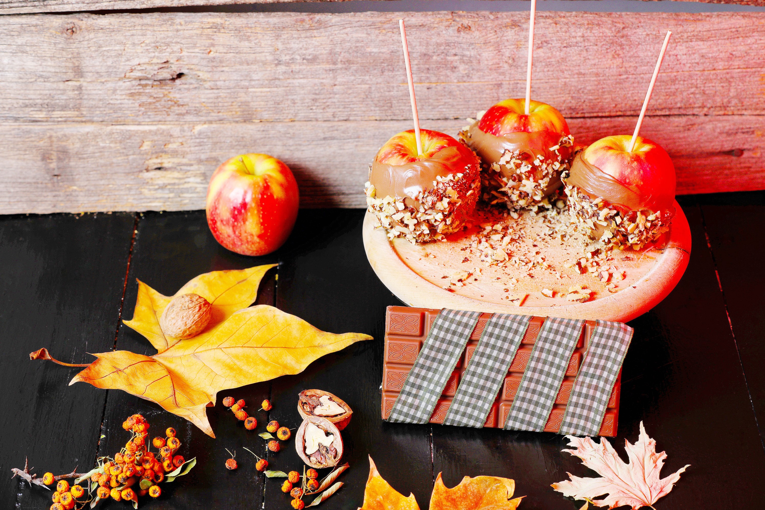 Chocolate-covered apples with nuts and chocolate bar HD Wallpaper