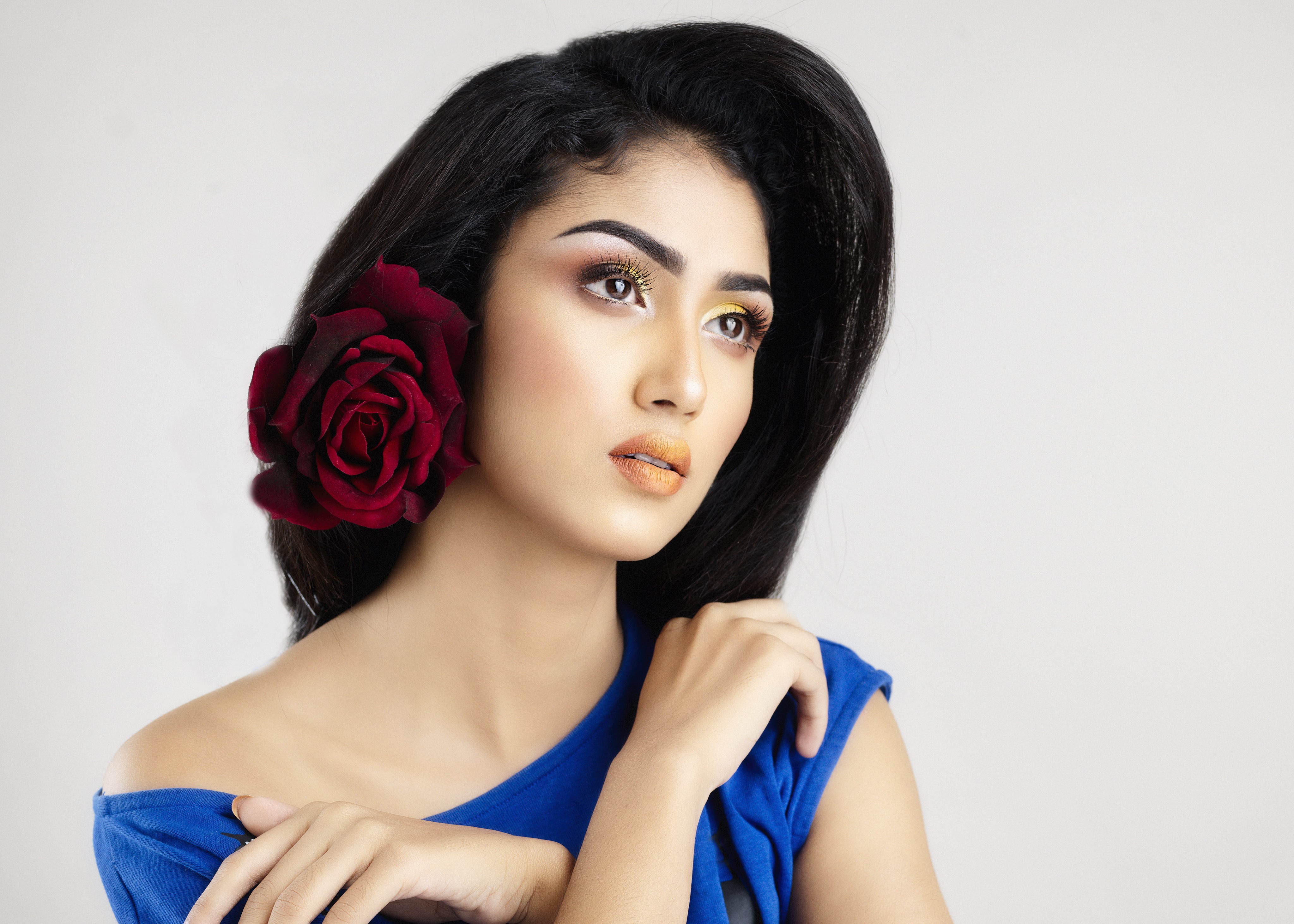 Brunette girl with rose and makeup HD Wallpaper