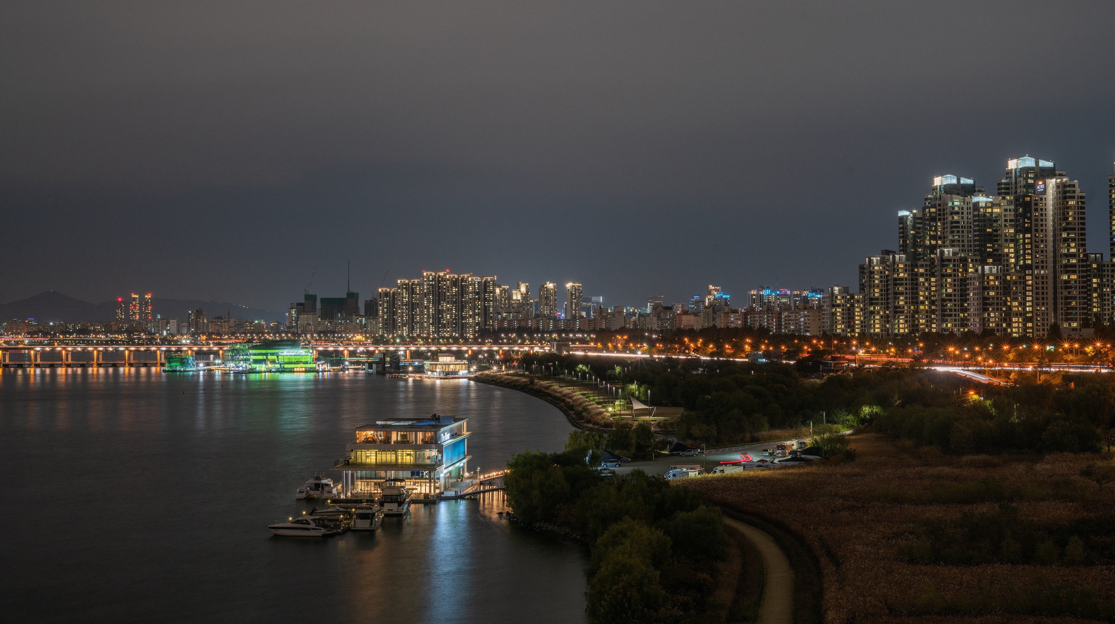 Seoul cityscape at night with Han River and buildings HD Wallpaper