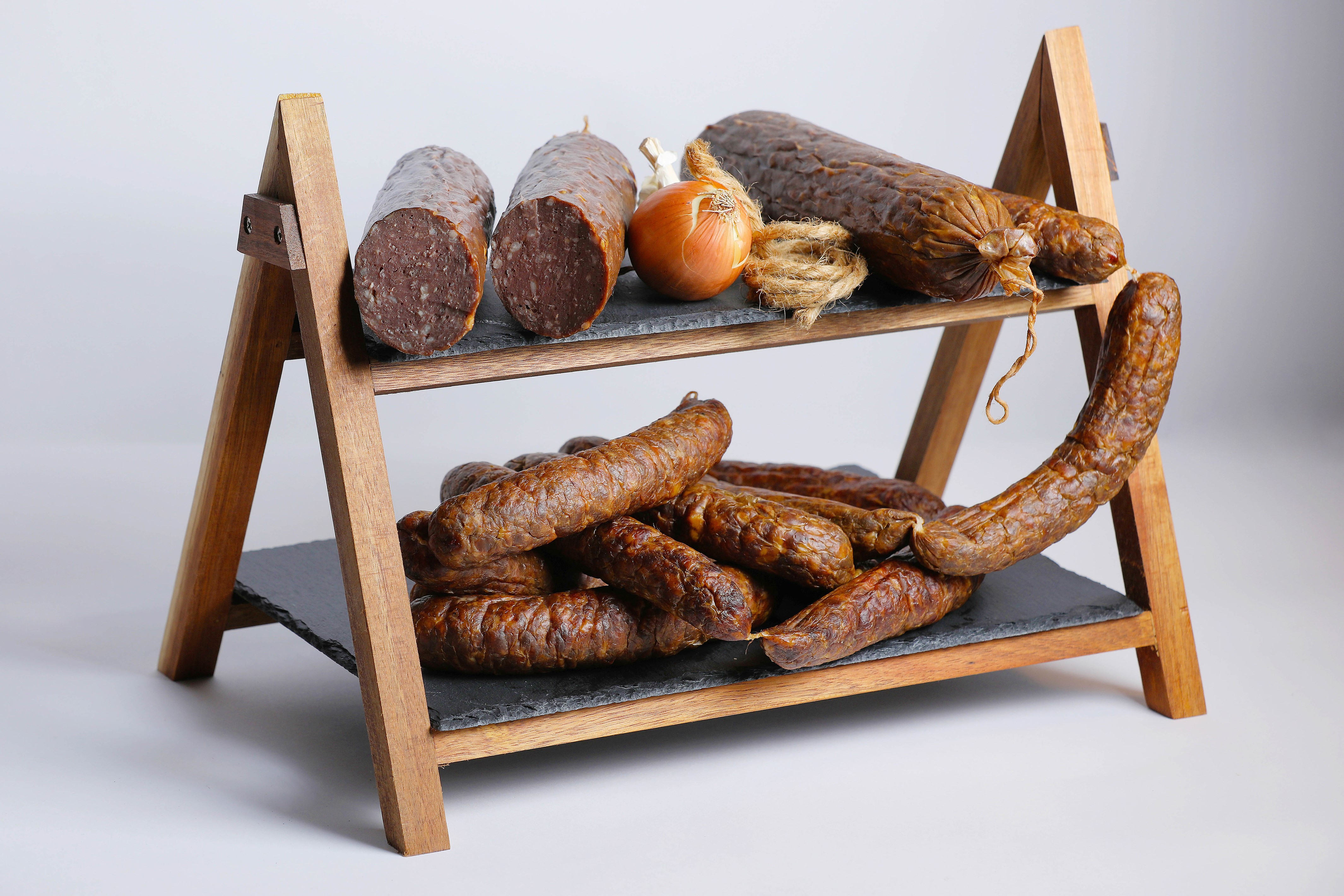 Sausages and Onion on a Wooden Stand HD Wallpaper