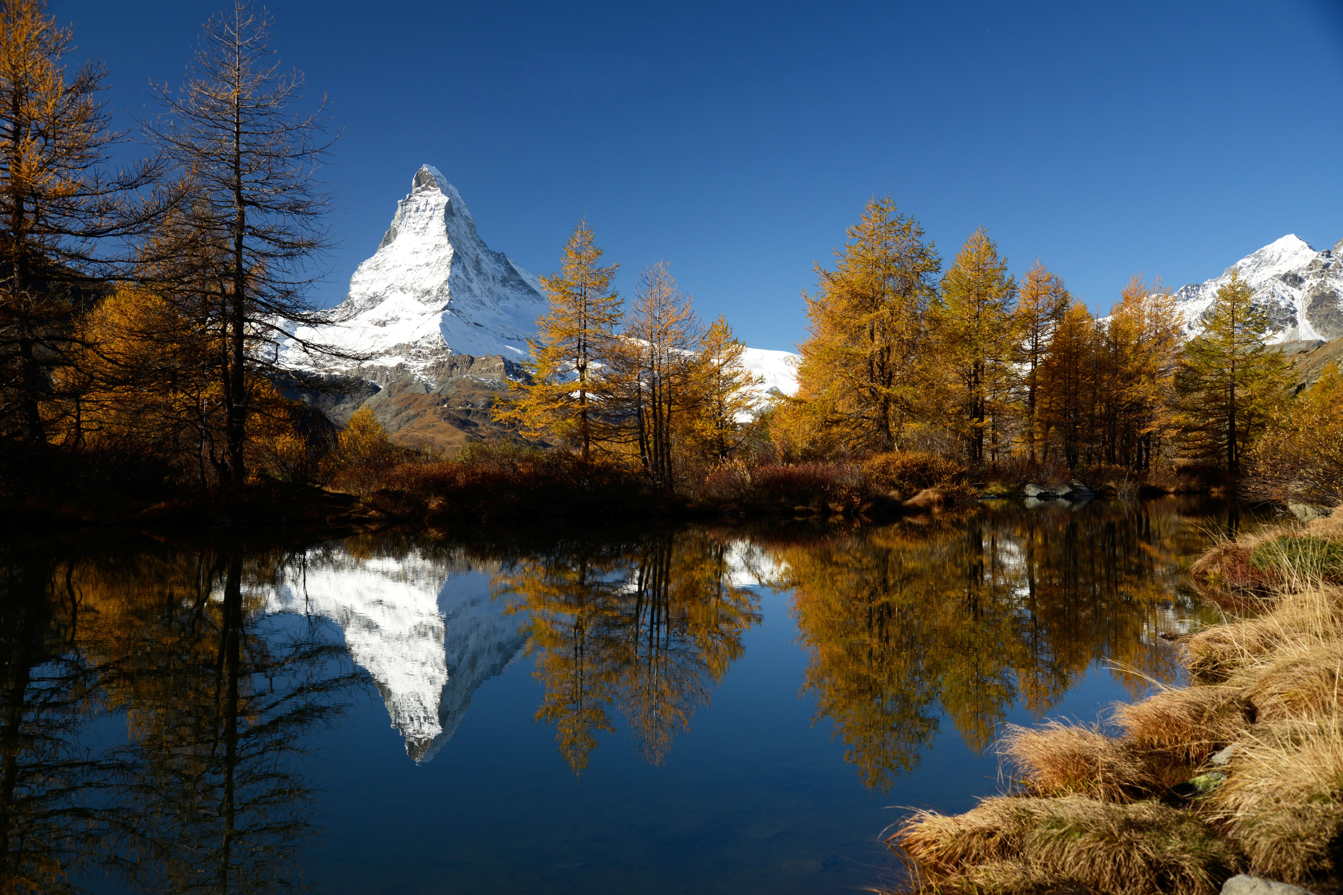 Matterhorn reflected in Grindjisee lake, Switzerland HD Wallpaper