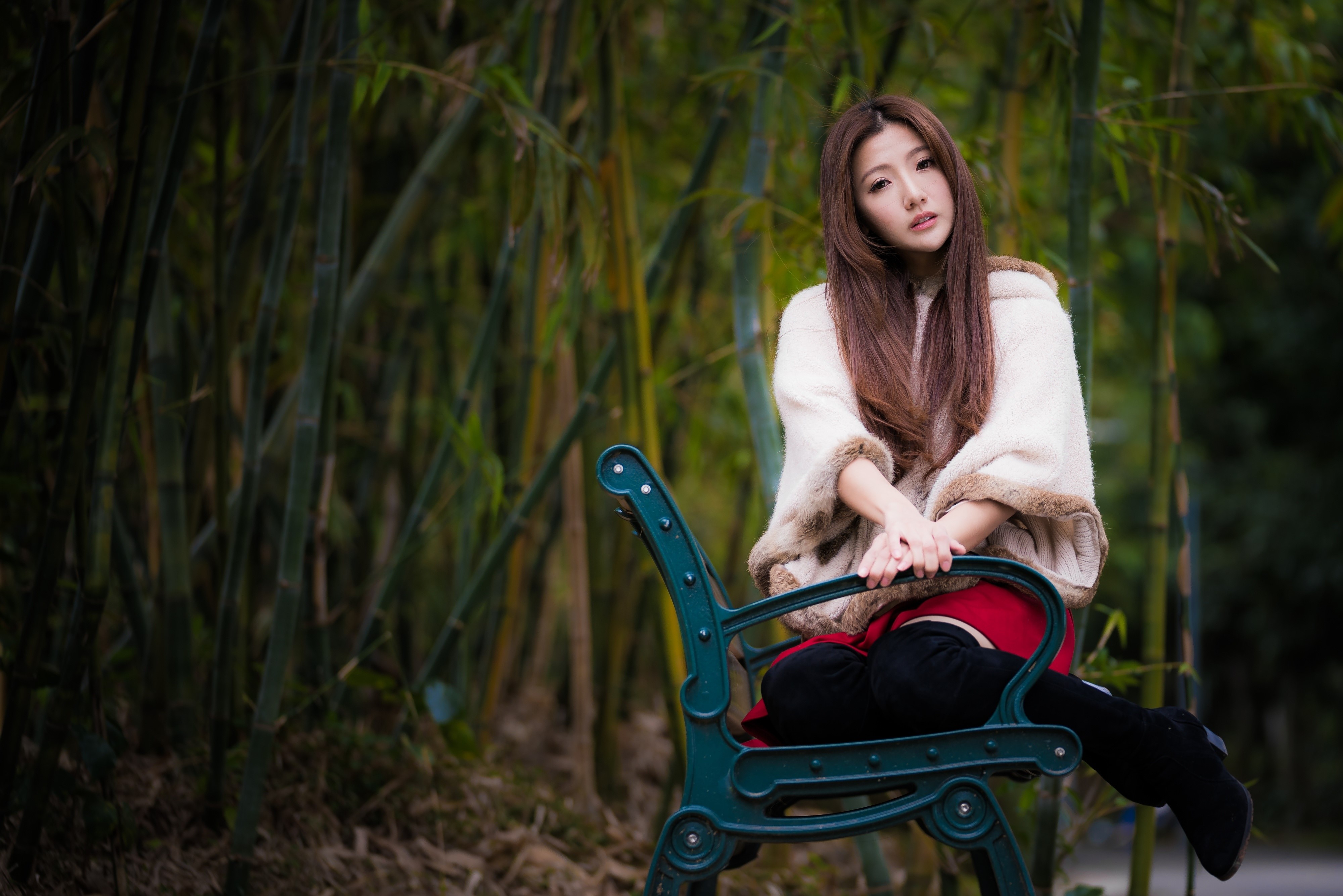 Asian woman with brown hair sitting on a bench HD Wallpaper
