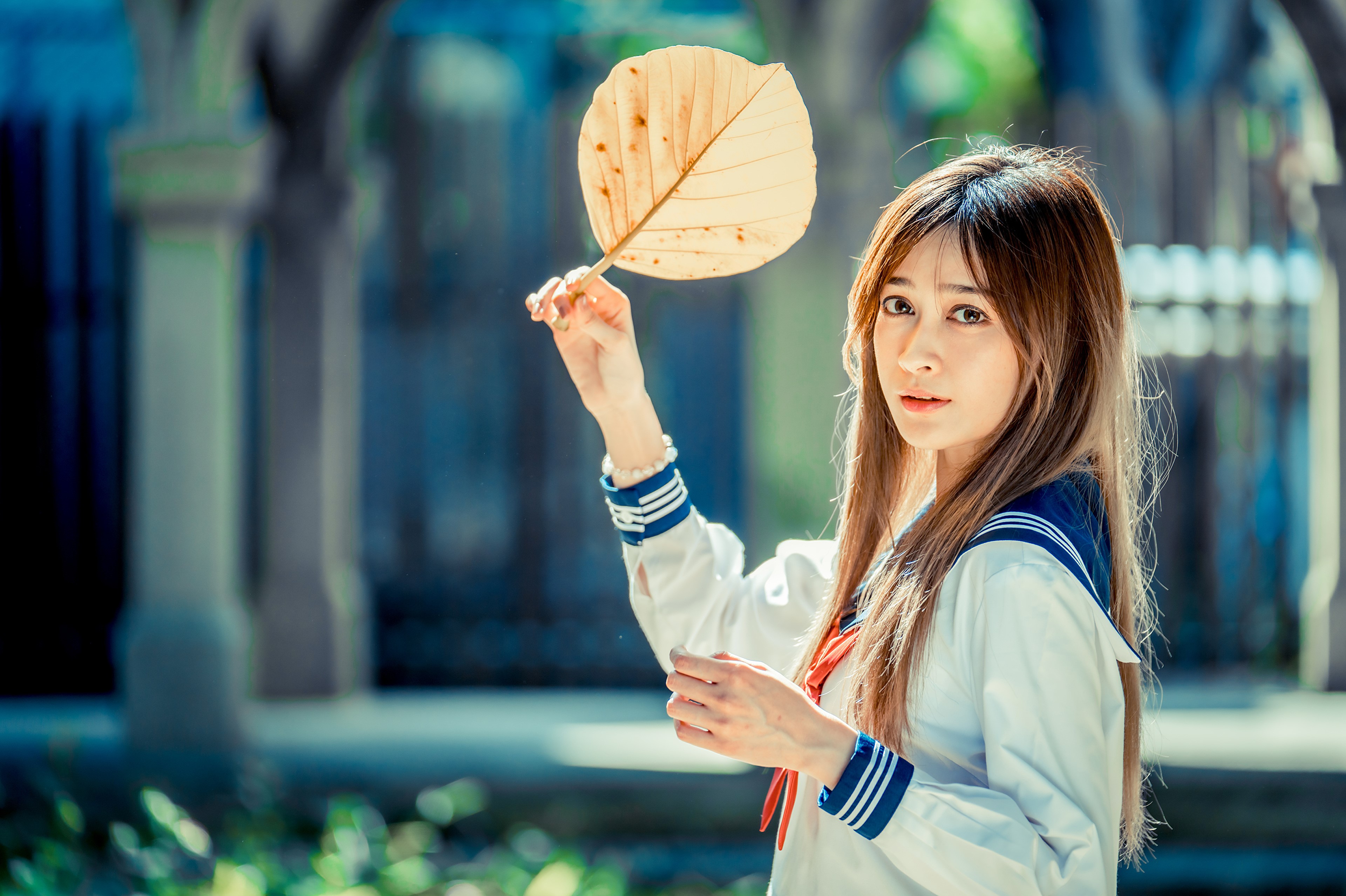 Asian girl in school uniform holding a leaf HD Wallpaper