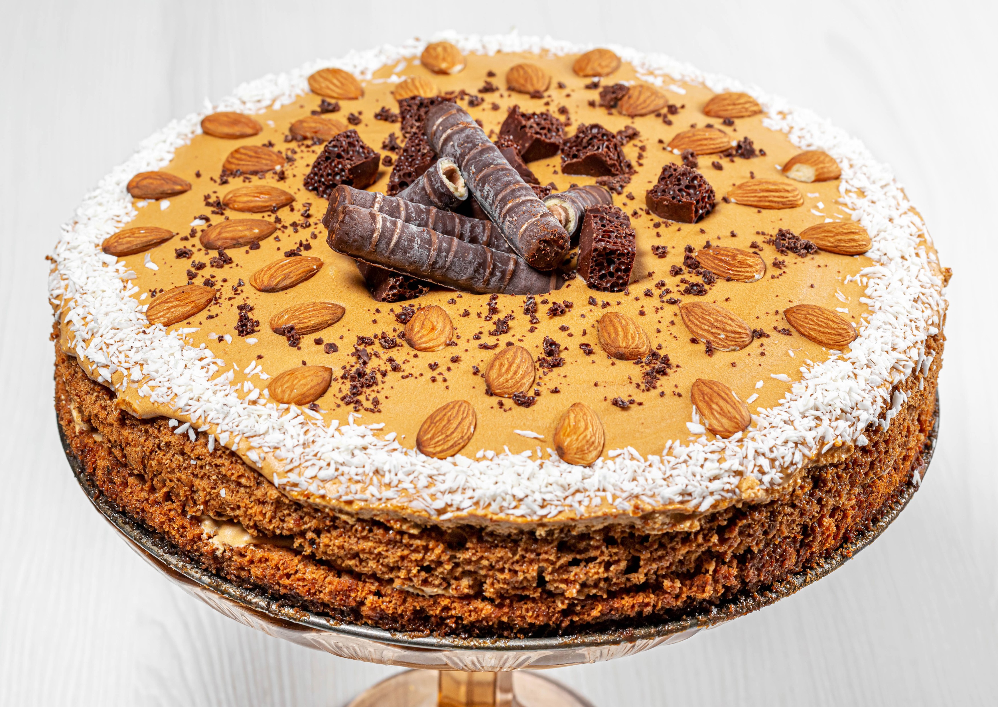 Chocolate cake with almonds and chocolate rolls HD Wallpaper