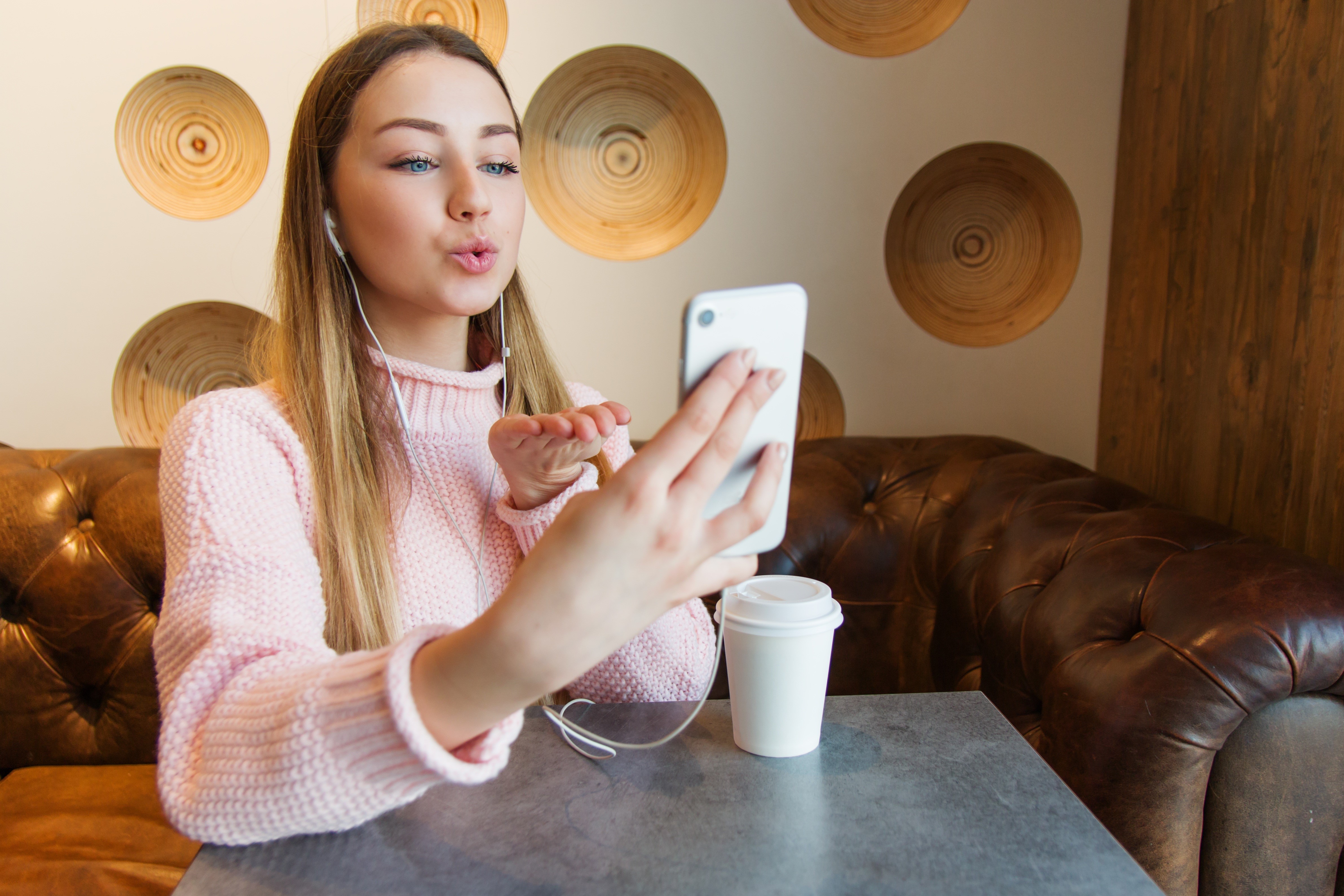 Woman taking a selfie with a smartphone HD Wallpaper