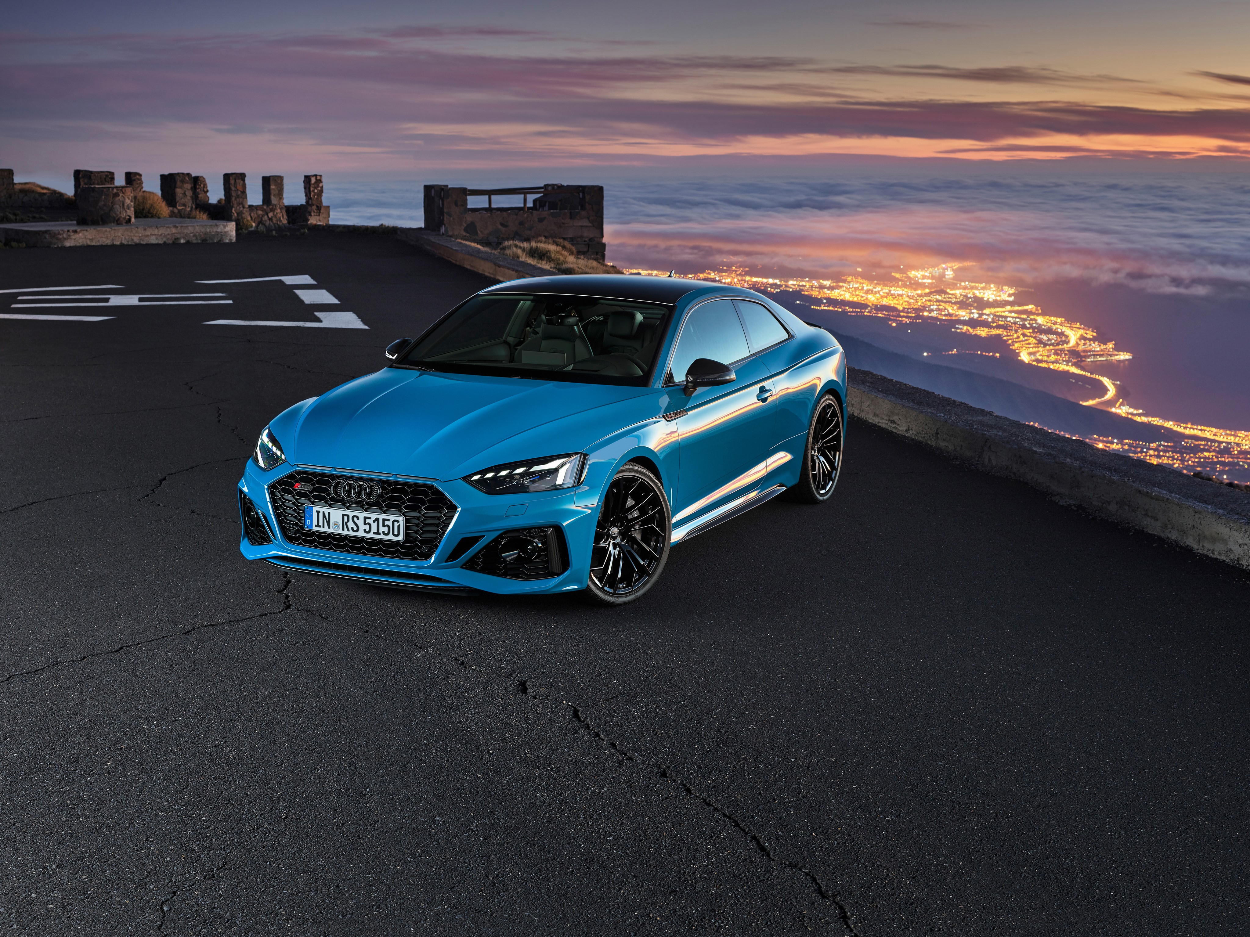 Audi RS 5 Coupe on a mountain road at sunset HD Wallpaper