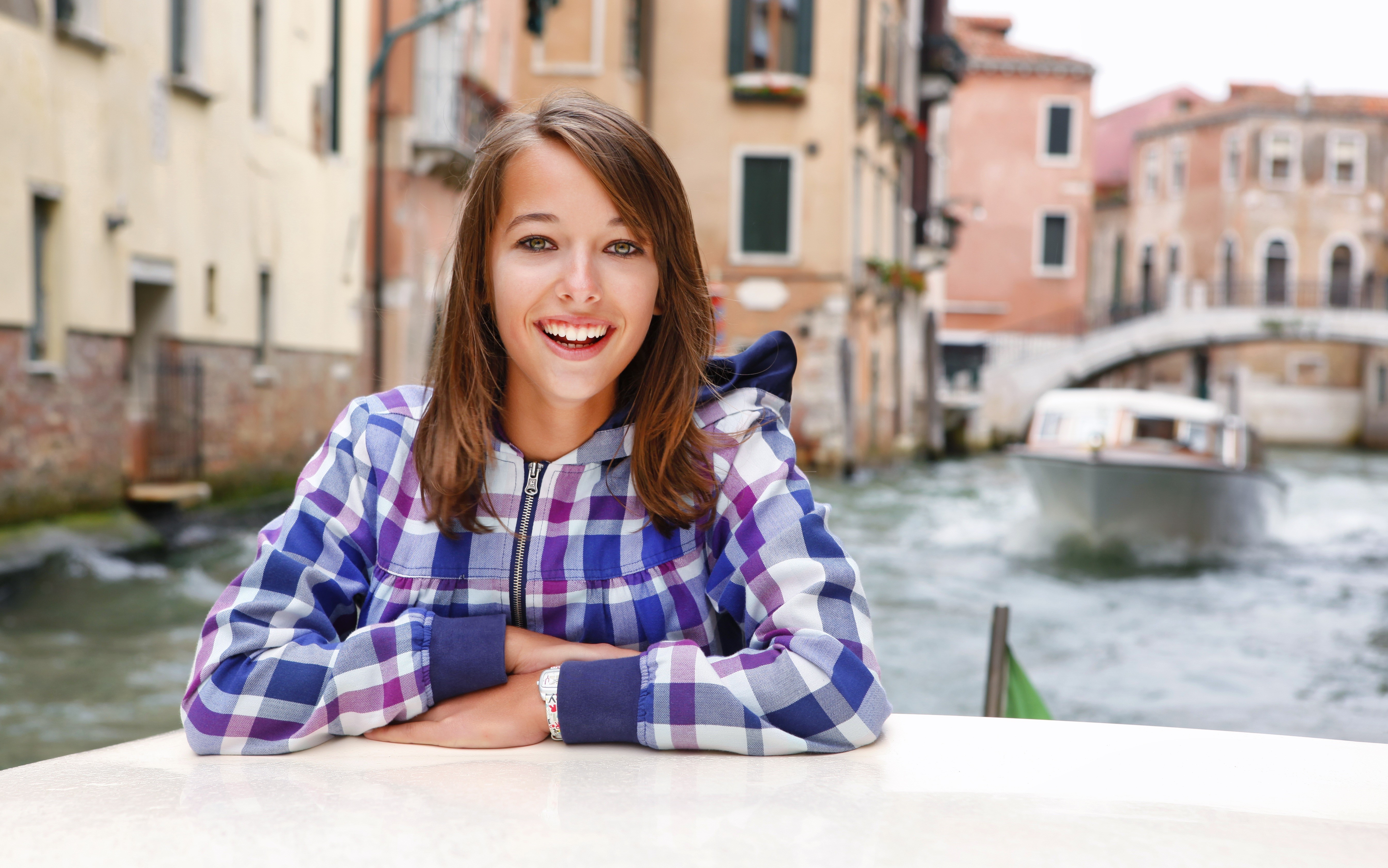 Girl smiling in Venice canal with motorboat HD Wallpaper