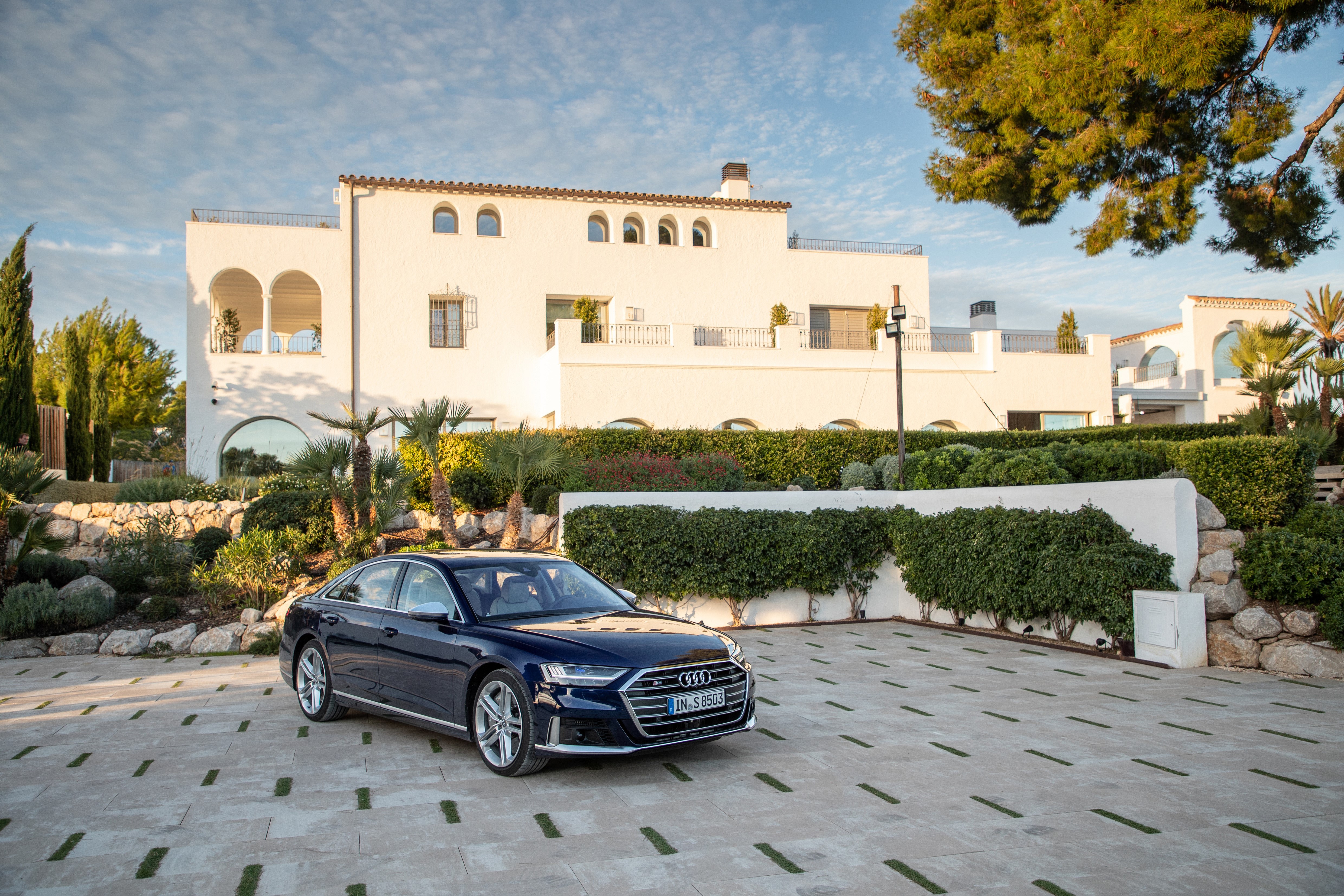 Blue Audi S8 parked in front of a white villa HD Wallpaper