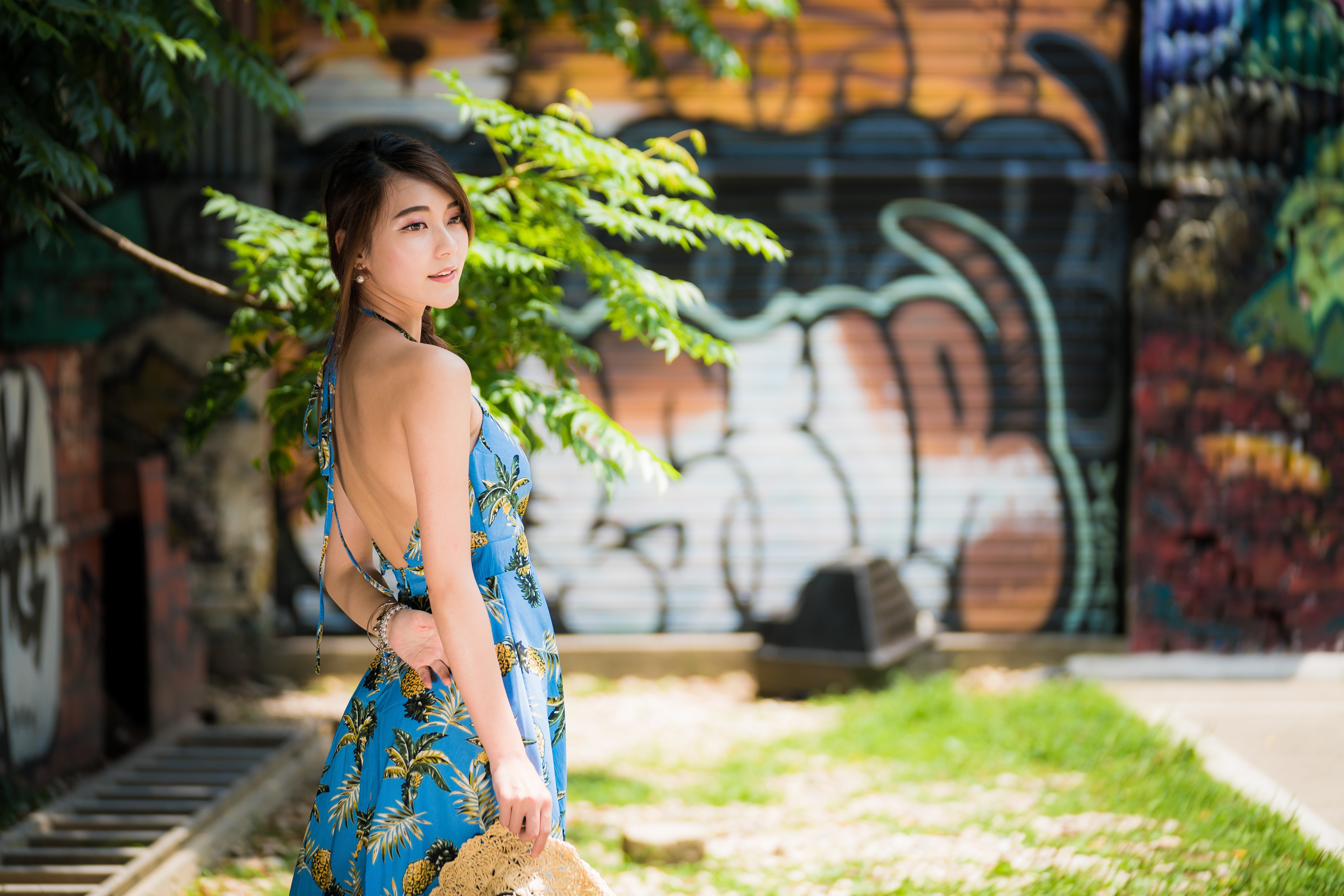 Asian woman in blue dress with pineapple print HD Wallpaper